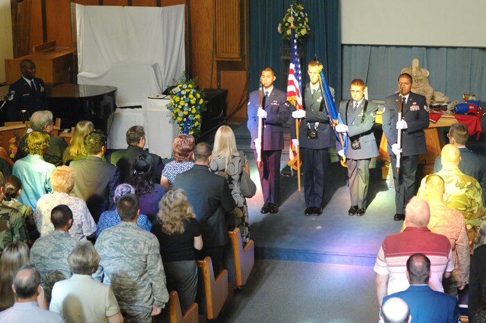 NELLIS AIR FORCE BASE, Nev. -- Members of the 99th Civil Engineer Squadron present the colors at 1st Lt. Dominic Romano's Memmorial Service July 22, 2008 at Base Chapel, here. Lieutenant Romano died July 18 from injuries sustained in a June motorcycle accident. (U.S. Air Force photo by Senior Airman Jason R. Huddleston)