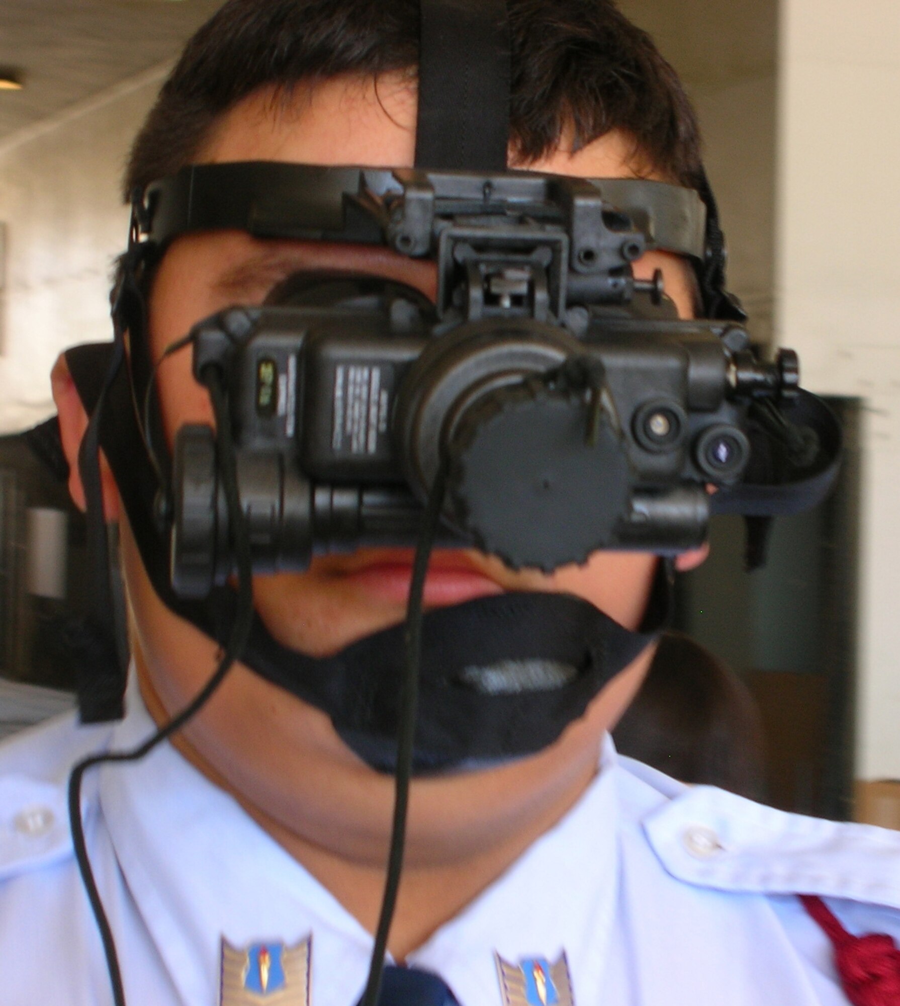 Cadet Tech. Sgt. Edward Herrera, 17, of Rancho Verde High School in Moreno Valley, Calif., looks through a set of night-vision goggles during an explosive ordnance disposal demonstration at March Air Reserve Base, Calif., in June 2008. The base hosted a two-week Summer Leadership School to give Junior Reserve Officer Training Corps cadets a snapshot of the skills used in the Air Force. (U.S. Air Force photo/Daniel Pilkington)