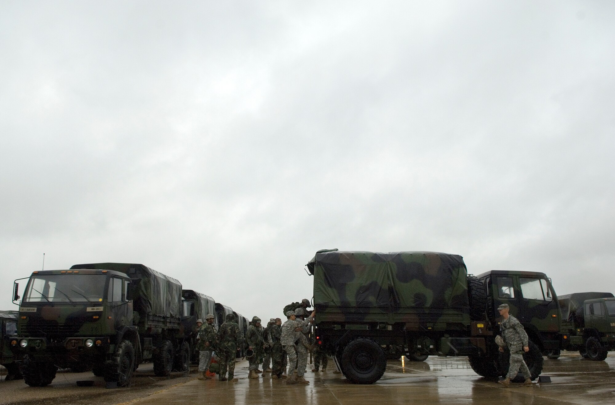 Members of the 449th Aviation Support Battalion arrive at to the Standing Joint InterAgency Task Force headquarters located at the Army National Guard Armory July 22 at Weslaco, Texas. Texas military forces are in southern Texas in anticipation of heavy flood relief efforts caused by Hurricane Dolly. The 449th Aviation Support Battalion are deployed from San Antonio. (U.S. Air Force photo/Staff Sgt. Bennie J. Davis III)