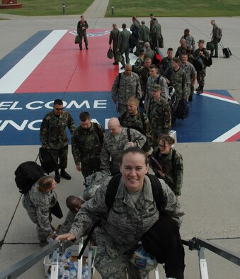 MINOT AIR FORCE BASE, N.D. -- Warbirds are all smiles as they board an aircraft July19 departing for Red Flag at Nellis Air Force Base, Nev. Red Flag is a two-week, realistic combat training exercise involving the air forces of the United States and its allies with the purpose of improving combat capabilities and tactical training. Almost 150 Warbirds will participate in the exercise. (U.S. Air Force photo by Airman 1st Class Wesley Wright)