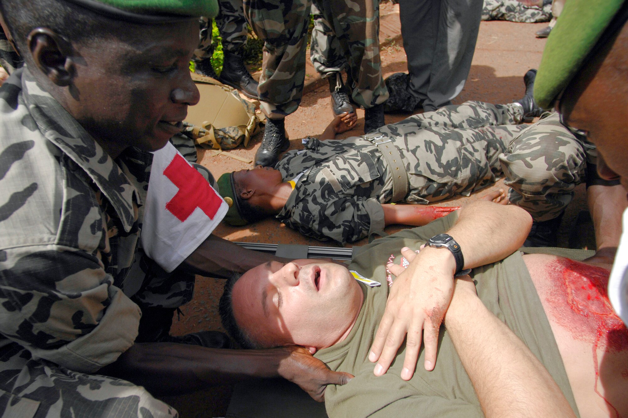 Malian medical personnel prepare to move U.S. Navy Petty Officer 3rd Class Scott Ott July 18 during a simulated mass casualty accident during MEDFLAG 08 in the village of Kati, Mali. More than 90 servicemembers deployed to Bamako, Mali, for MEDFLAG 08, a multi-national medical training exercise designed to enhance medical capabilities and readiness for U.S. and African Forces. Petty Officer Ott is deployed from the 4th Dental Battalion, Sacramento Naval Operations Support Center, Calif. (U.S. Air Force photo/Senior Airman Michael S. Dorus) 