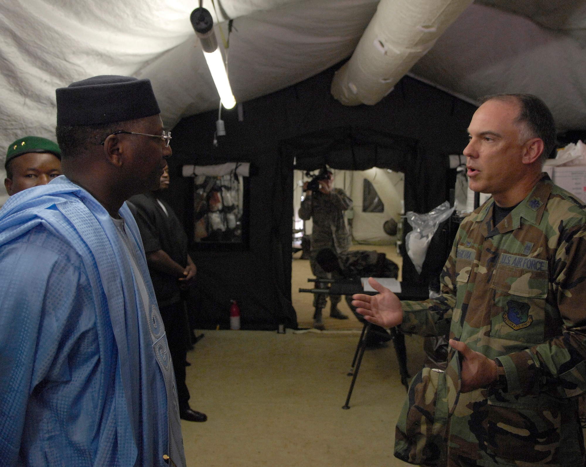 Lt. Col. Troy McGilvra gives Malian Prime Minister Modibo Sidibe a tour of the expeditionary medical support facility July 18 during a mass casualty exercise at Kati village. More than 90 servicemembers deployed to Bamako, Mali, for MEDFLAG 08, a multi-national medical training exercise designed to enhance medical capabilities and readiness for U.S. and African Forces. Colonel McGilvra is the commander of MEDFLAG 08 and is deployed from the 31st Medical Group, Aviano Air Base, Italy. (U.S. Air Force photo/Senior Airman Michael S. Dorus) 