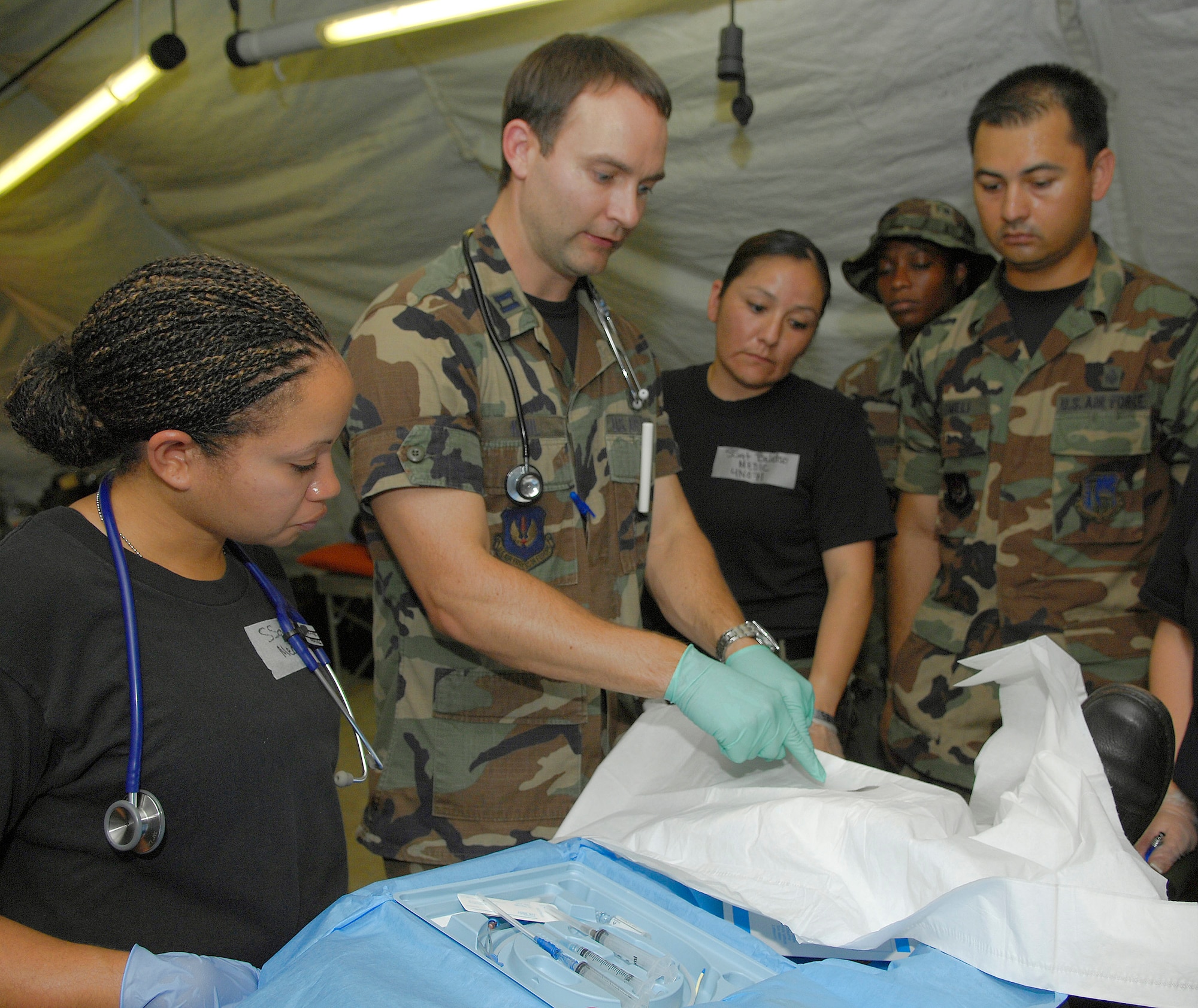 Capt. Chad Khal teaches Airmen about central line insertion procedures July 18 during a mass casualty exercise in Bamako, Mali. More than 90 servicemembers deployed  for MEDFLAG 08, a multi-national medical training exercise designed to enhance medical capabilities and readiness for U.S. and African Forces. Captain Khal is a family practitioner deployed from the 31st Medical Group, Aviano Air Base, Italy. (U.S. Air Force photo/Senior Airman Michael S. Dorus) 