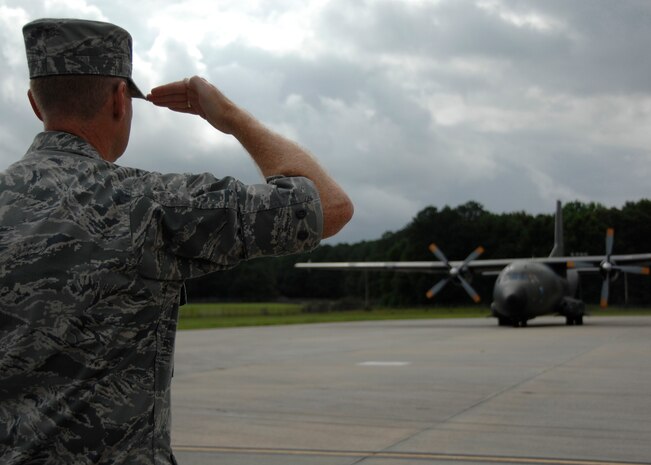 Col. John "Red" Millander salutes German Generalmajor Ahrens Hans-Werner as his plane lands on Charleston AFB July 21. The German general visited Charleston AFB for an orientation of the C-17 and to gain greater knowledge of the capabilities of the aircraft. Colonel Millander is the 437th Airlift Wing commander and General Hans-Werner is the commander of the German Air Force Air Transport Command. (U.S. Air Force photo/Airman 1st Class Katie Gieratz)