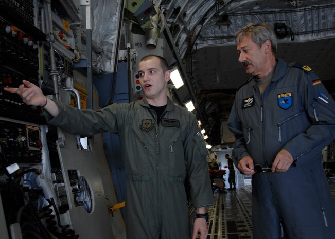 Staff Sgt. Jeff Harmon briefs German Generalmajor Ahrens Hans-Werner about a C-17 on the Charleston AFB flightline July 21. The German general visited Charleston AFB for an orientation of the C-17 and to gain greater knowledge of the capabilities of the aircraft.  Sergeant Harmon is a loadmaster with the 14 Airlift Squadron, General Hans-Werner is the commander of the German Air Force Air Transport Command. (U.S. Air Force photo/Airman 1st Class Katie Gieratz)