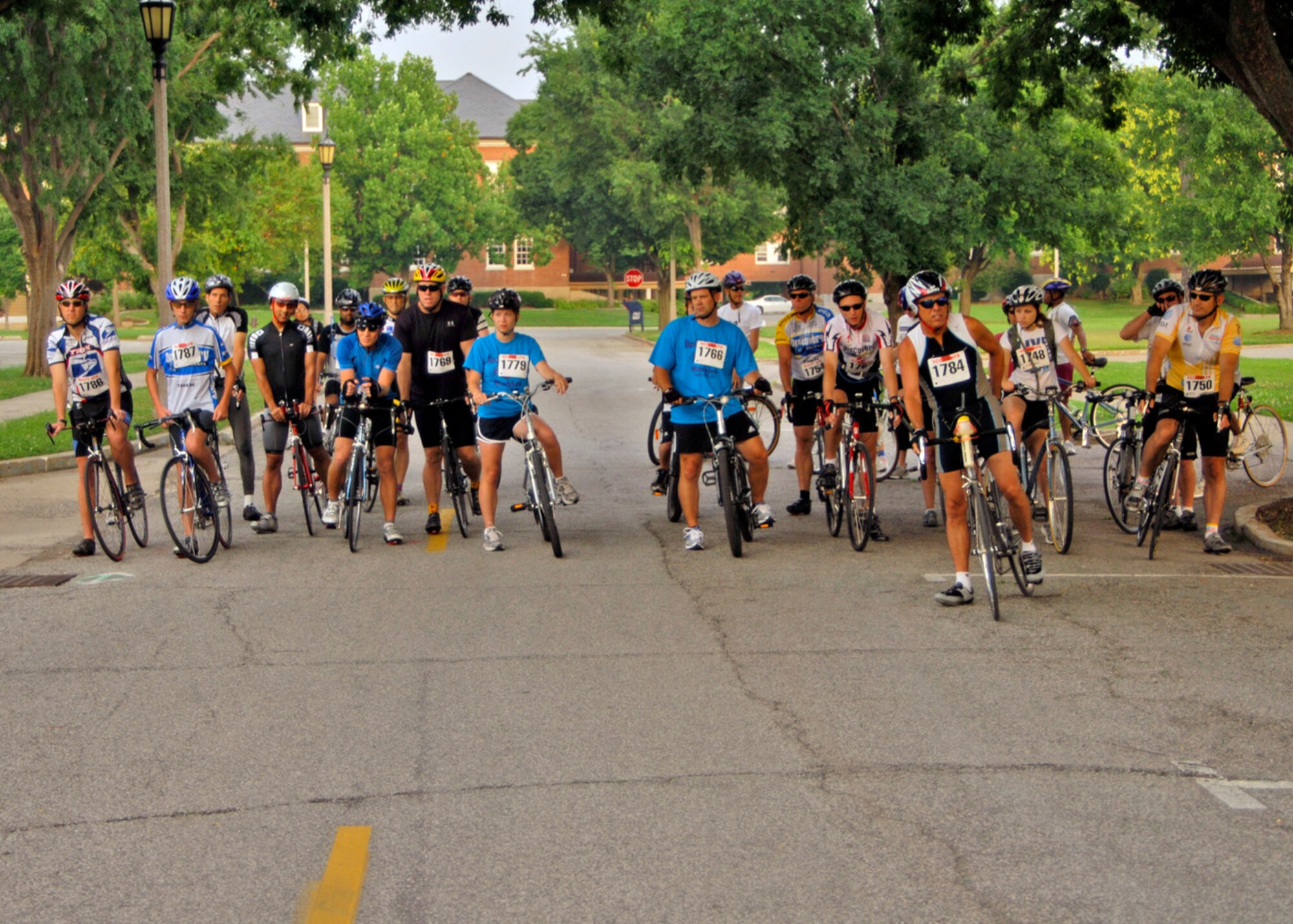 SCOTT AIR FORCE BASE, Ill. -- Members of JTF Scott line up for the start of the Blazing Bike Race behind the fitness center July 19. The Blazing Bike Race was held to get people out exercising and to have fun while doing it. The race was open to people of all ages and was approximately 20-miles long. 
(US Air Force photo/Airman 1st Class Wesley Farnsworth)