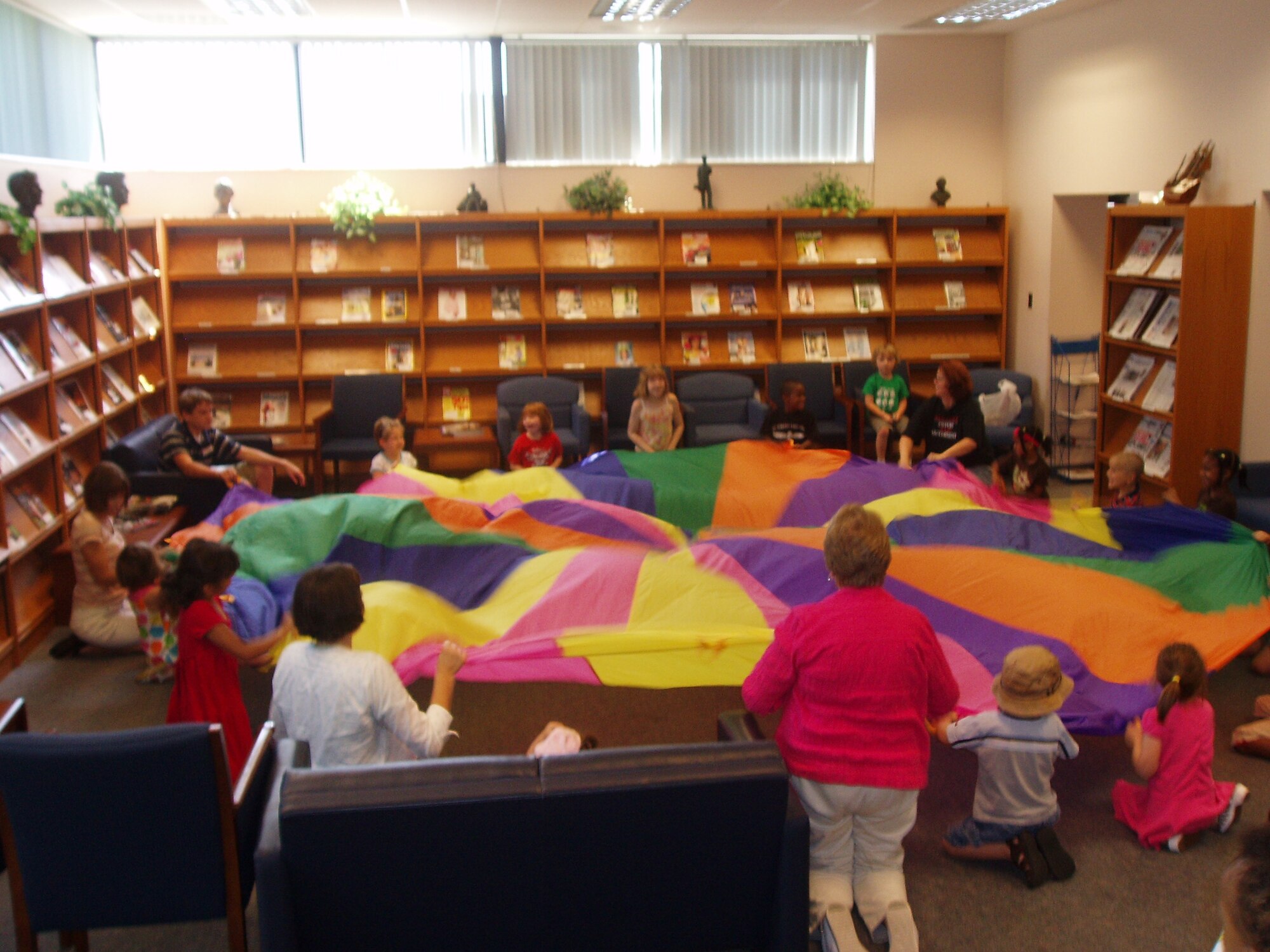 SCOTT AIR FORCE BASE, Ill. -- Participants in the base summer reading program were treated last week to parachute play as one of the many weekly activities that took place during the two-month program at the base library. More than 450 children of all ages took part in the program this year.
Courtesy photo