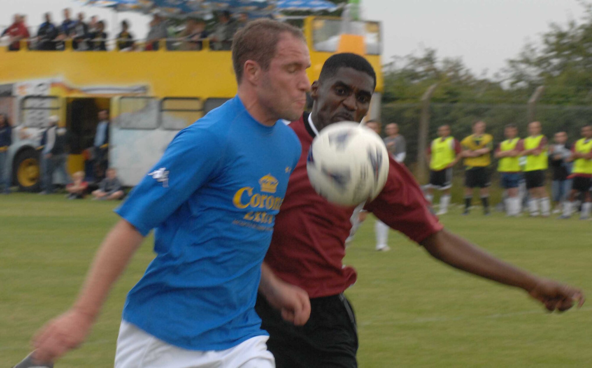 RAF MILDENHALL, England -- Corona All-stars player Jorn Radu (left) goes on the attack while Chief Master Sgt. Roy Bowden from RAF Lakenheth defends in the RAF Mildenhall-RAF Lakenheth All-stars vs. Corona All-star game July 18. The exhibition game was part of Extreme Summer, a points-for-participation program sponsored by U.S. Air Forces in Europe Services. The RAF Mildenhall-Lakenheath All-stars pulled off a close 6-5 victory. (U.S. Air Force photo by Airman 1st Class Brad Smith)     