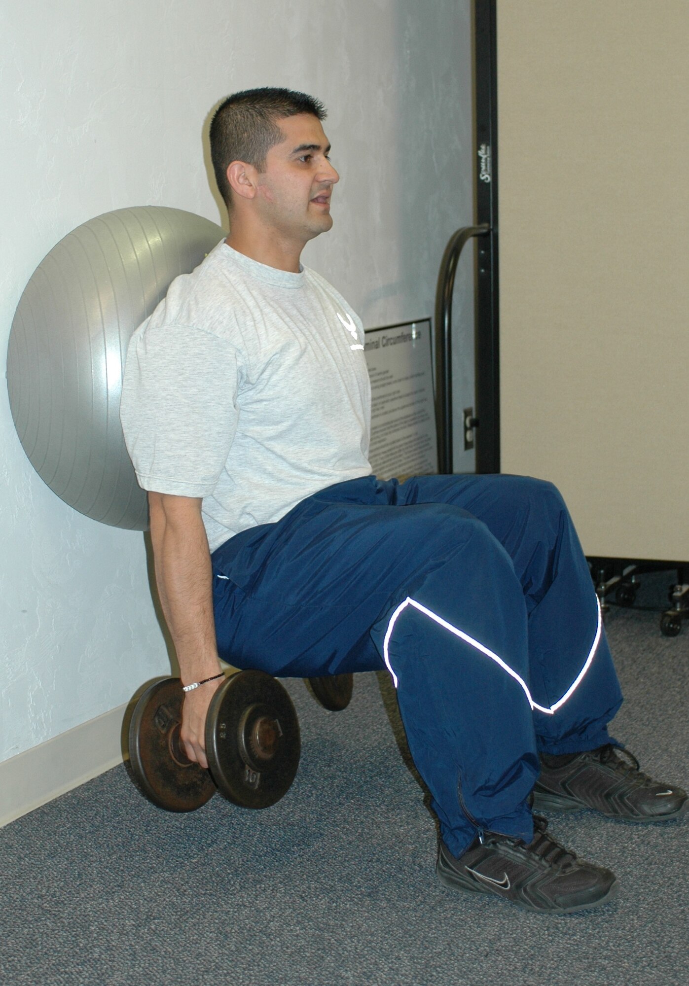 Staff Sgt. Virgil Mendivil exercises during a 9G session. “I didn’t think I was overweight when I joined the program, but my pre-assessment results were eye-opening.  I learned that no matter how skinny you are, your body fat percentage will affect your body’s overall performance,” he said. (Air National Guard photo by Capt. Gabe Johnson)