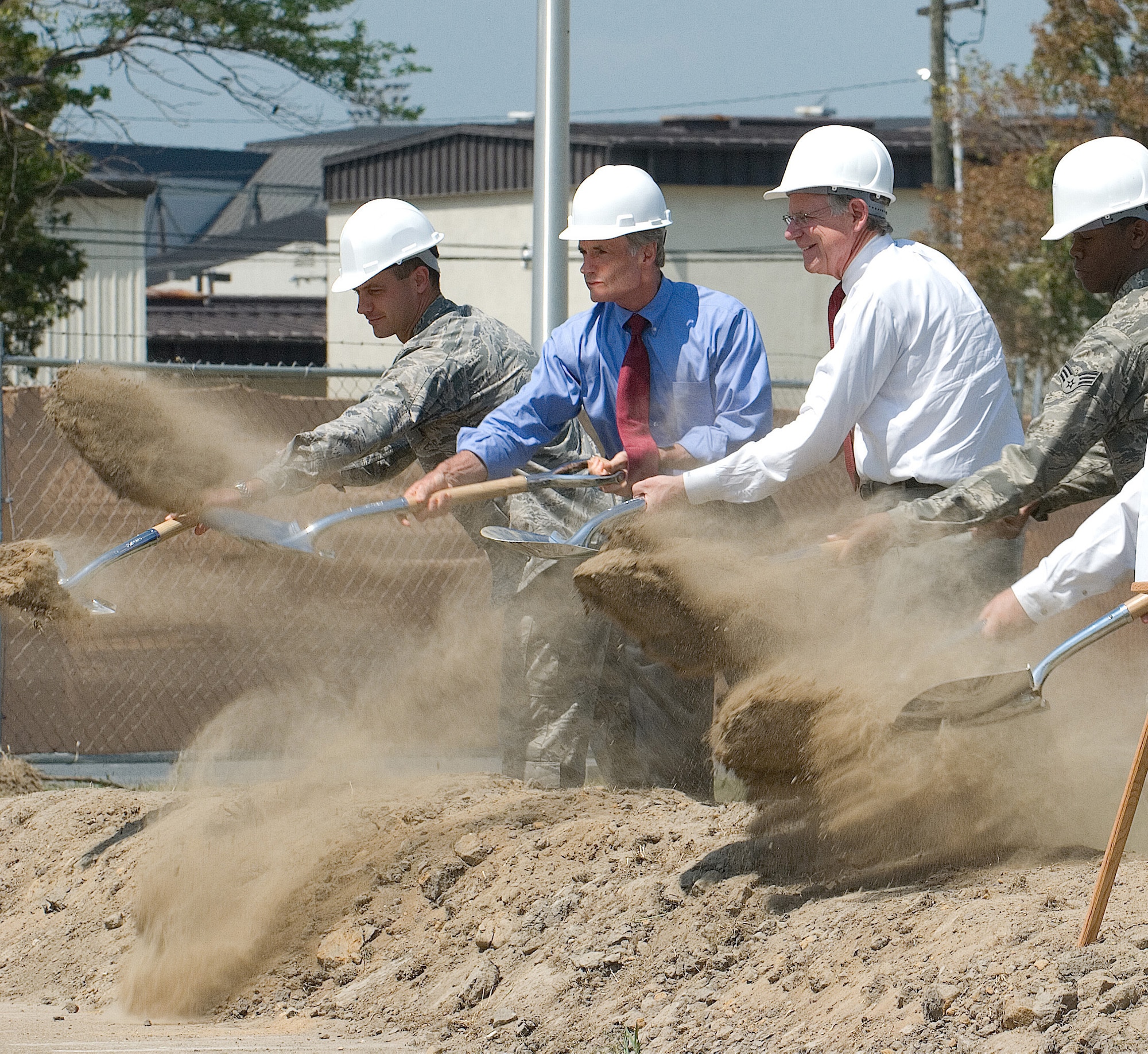 (Left to right) Col. Steven Harrison, 436th Airlift Wing commander, U.S. Senator Thomas Carper, U.S. Rep. Mike Castle, Senior Airman Carey Davis, Dorm 401 and 402 dorm council president, along with (not shown) Pete Ksenich, Kent Construction and Mike Wheedleton, Davis, Bowen and Friedel Inc., dig in their shovels to officially break ground on Dover’s newest dormitory. (U.S. Air Force photo/Roland Balik)