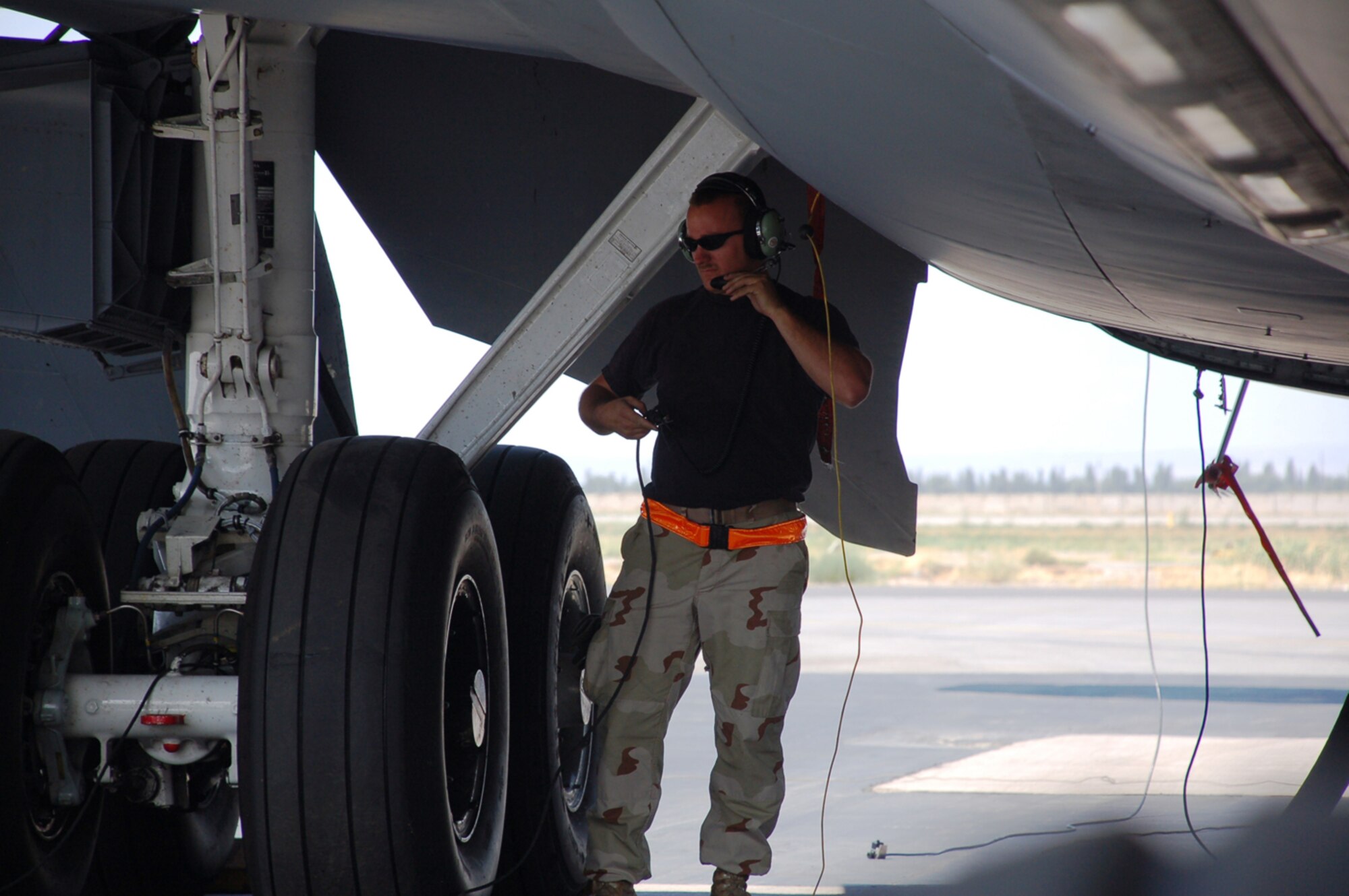 MANAS AIR BASE, Kyrgyz Republic -- Staff Sgt. Michael Overman, A KC-135 crew chief deployed here from Fairchild Air Force Base, Wash., refuels one of the 376th Air Expeditionary Wing's tankers, July 23. Maintainers, aircrew and support personnel helped Manas bust through the million pound mark July 17, when its KC-135 fleet offloaded 1.01 million pounds of fuel to an array of aircraft supporting combat operations in Afghanistan. (U.S. Air Force photo / Maj. Damien Pickart)