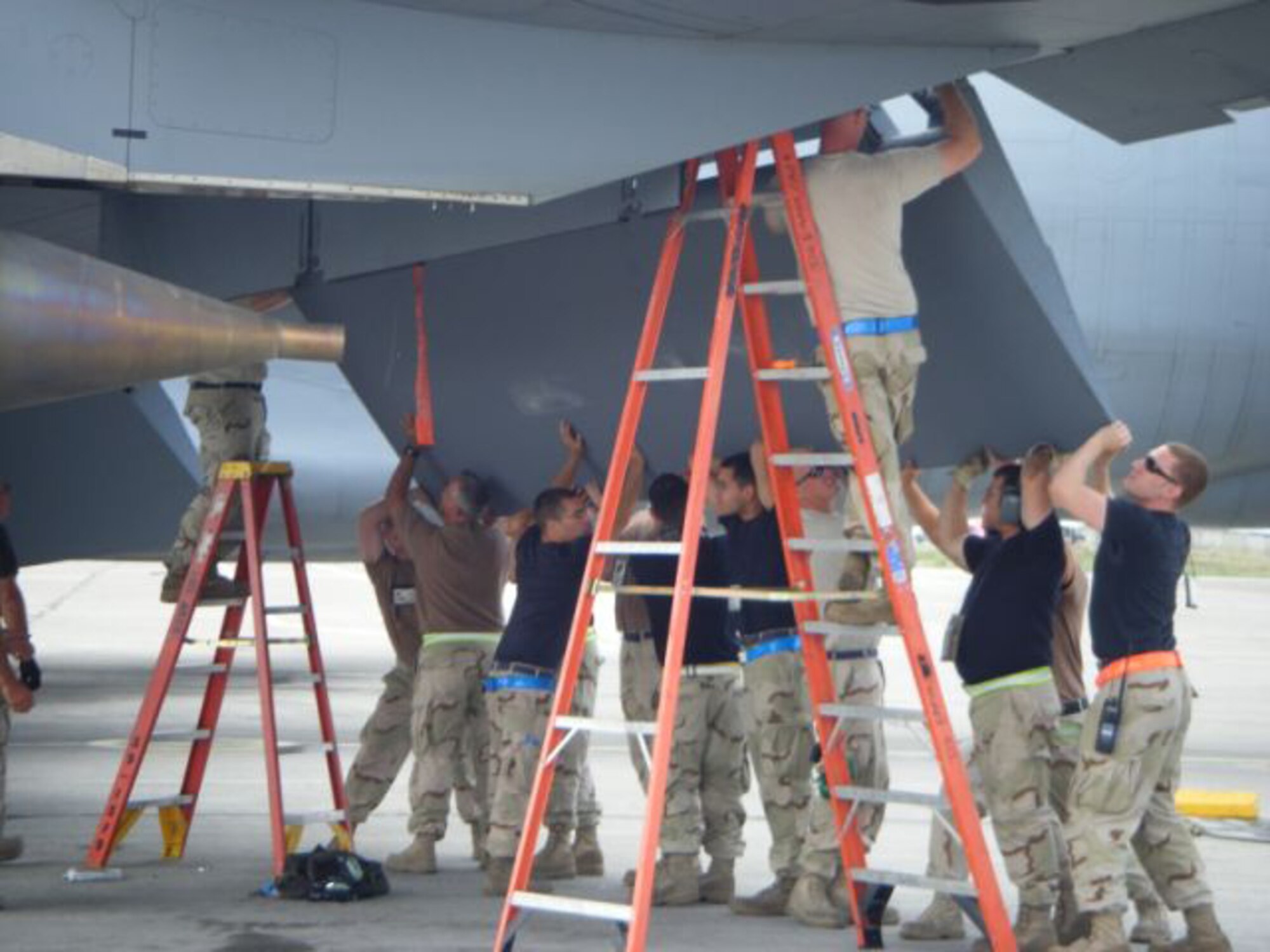 MANAS AIR BASE, Kyrgyz Republic -- Maintenance personnel assigned to the 376th Air Expeditionary Wing change out a KC-135 flap here. Maintainers, aircrew and support personnel from the wing helped Manas bust through the million pound mark July 17, when its KC-135 fleet offloaded 1.01 million pounds of fuel to an array of aircraft supporting combat operations in Afghanistan. (U.S. Air Force courtesy photo)