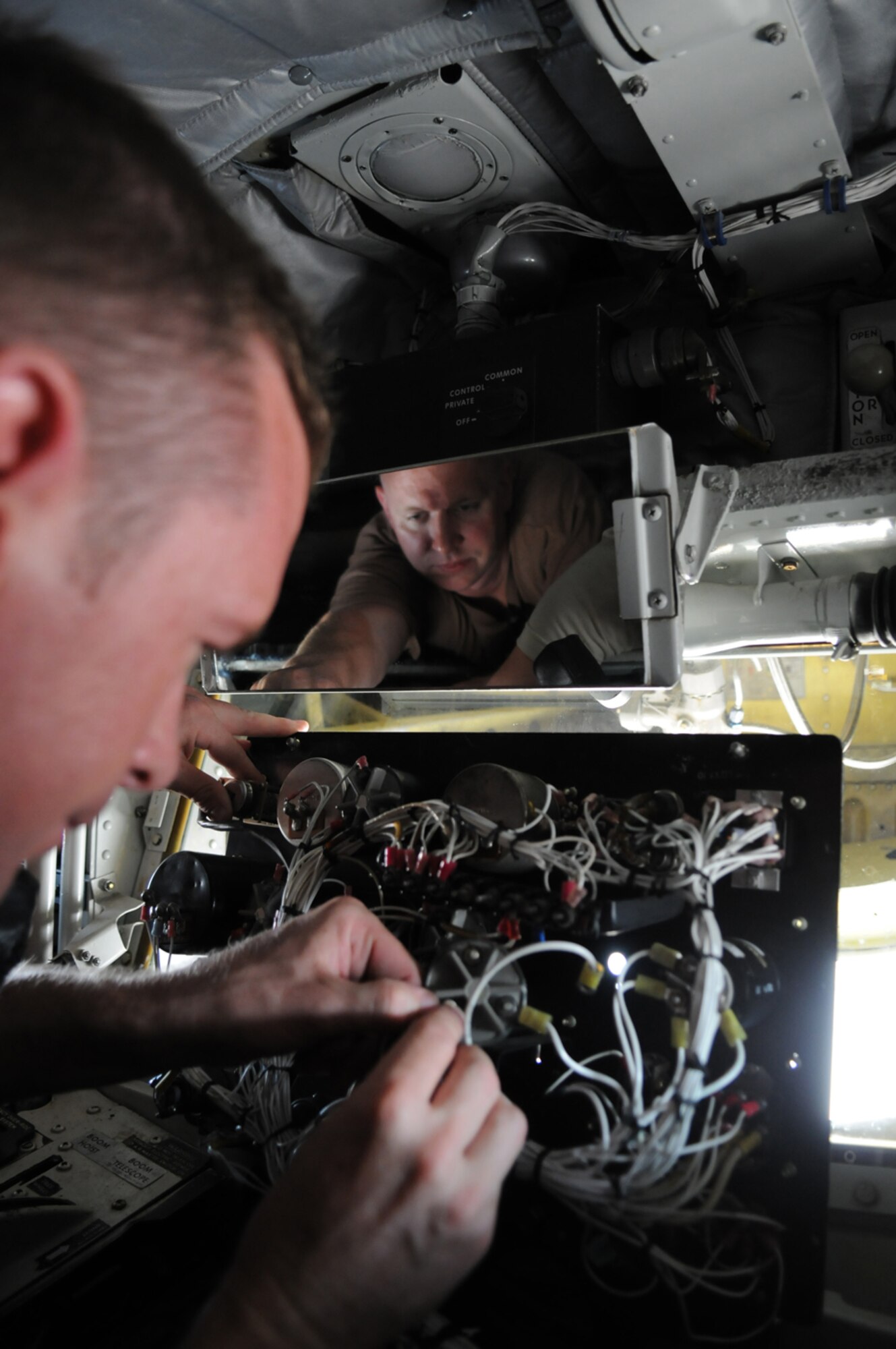 MANAS AIR BASE, Kyrgyz Republic -- Tech. Sgt. Jeremy Metzger, 376th Expeditionary Aircraft Maintenance Squadron, replaces a lighting transformer on a KC-135 during routine maintenance operations. Maintainers, aircrew and support personnel from the 376th Air Expeditionary Wing helped Manas bust through the million pound mark July 17, when the wing's KC-135s offloaded 1.01 million pounds of fuel to an array of aircraft supporting combat operations over Afghanistan. (U.S. Air Force photo / Airman 1st Class Ruth Holcomb)
