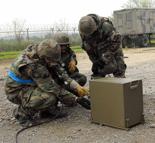 OSAN AIR BASE, Republic of Korea -- Members of the 51st Civil Engineering Squadron prepare emergency runway lighting during exercise Beverly Bulldog 08-03 July 23. The week-long operational readiness exercise tests Team Osan's ability to execute combat operations, receive follow-on forces and defend the base from attack. (U.S. Air Force photo/Master Sgt. Marlin Zimmerman)