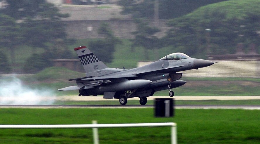OSAN AIR BASE, Republic of Korea -- An F-16 Fighting Falcon, assigned to the 36th Fighter Squadron, burns rubber after landing during a base-wide exercise here July 23. The operational readiness exercise tests Team Osan's ability to execute combat operations, receive follow-on forces and defend the base from attack. (U.S. Air Force photo/Senior Airman Christopher Boitz)