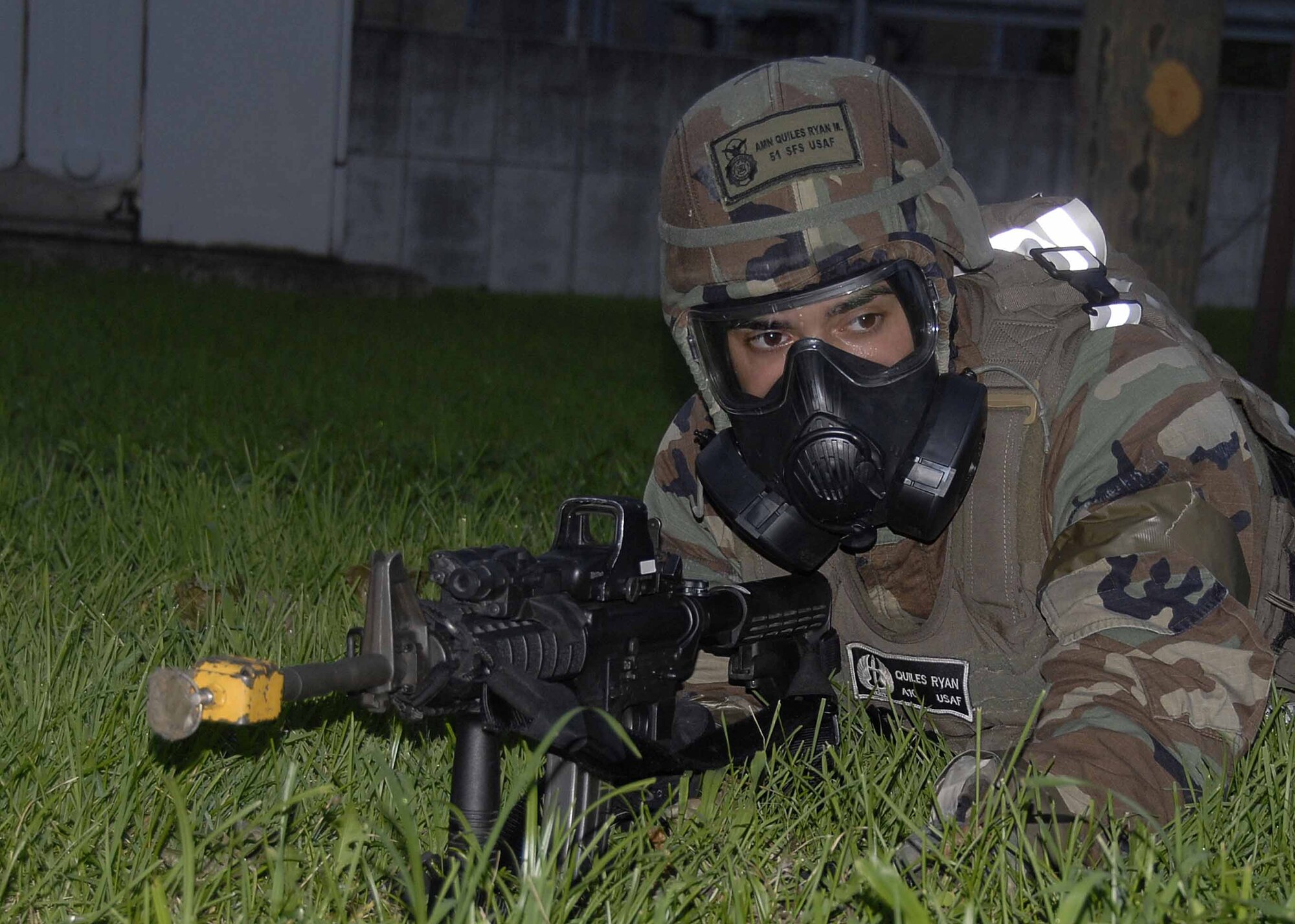 OSAN AIR BASE, Republic of Korea -- Airman 1st Class Ryan Quiles, 51st Security Forces Squadron, surveys the scene for suspicious activity during exercise Beverly Bulldog 08-03 July 22. (U.S. Air Force photo/Staff Sgt. Scottie McCord)