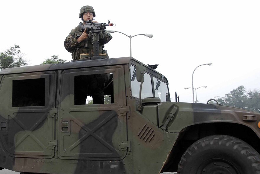OSAN AIR BASE, Republic of Korea -- Airman 1st Class Kendall Wilson, 51st Security Forces Squadron, mans the M240B machine gun atop a Humvee during exercise Beverly Bulldog 08-03 July 22. (U.S. Air Force photo/Staff Sgt. Scottie McCord)