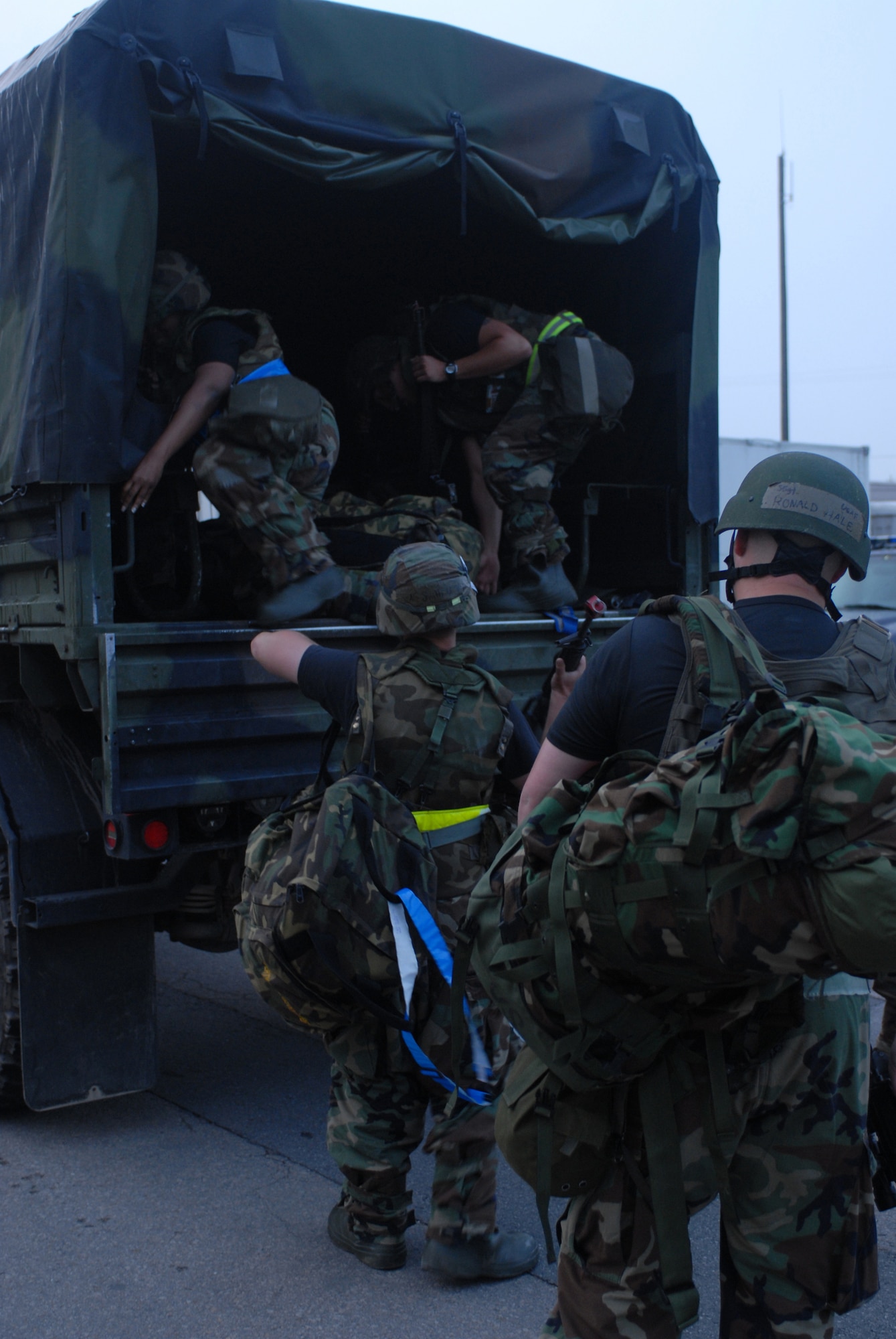 KUNSAN AIR BASE, Republic of Korea -- Members of the 8th Security Forces Squadron load on to a truck to begin their twelve hour shift during the peninsula wide operational readiness exercise, July 23.  Kunsan is participating in the PENORE to evaluate its readiness and ability to conduct its wartime mission. (U.S. Air Force photo/Senior Airman Gustavo Gonzalez)