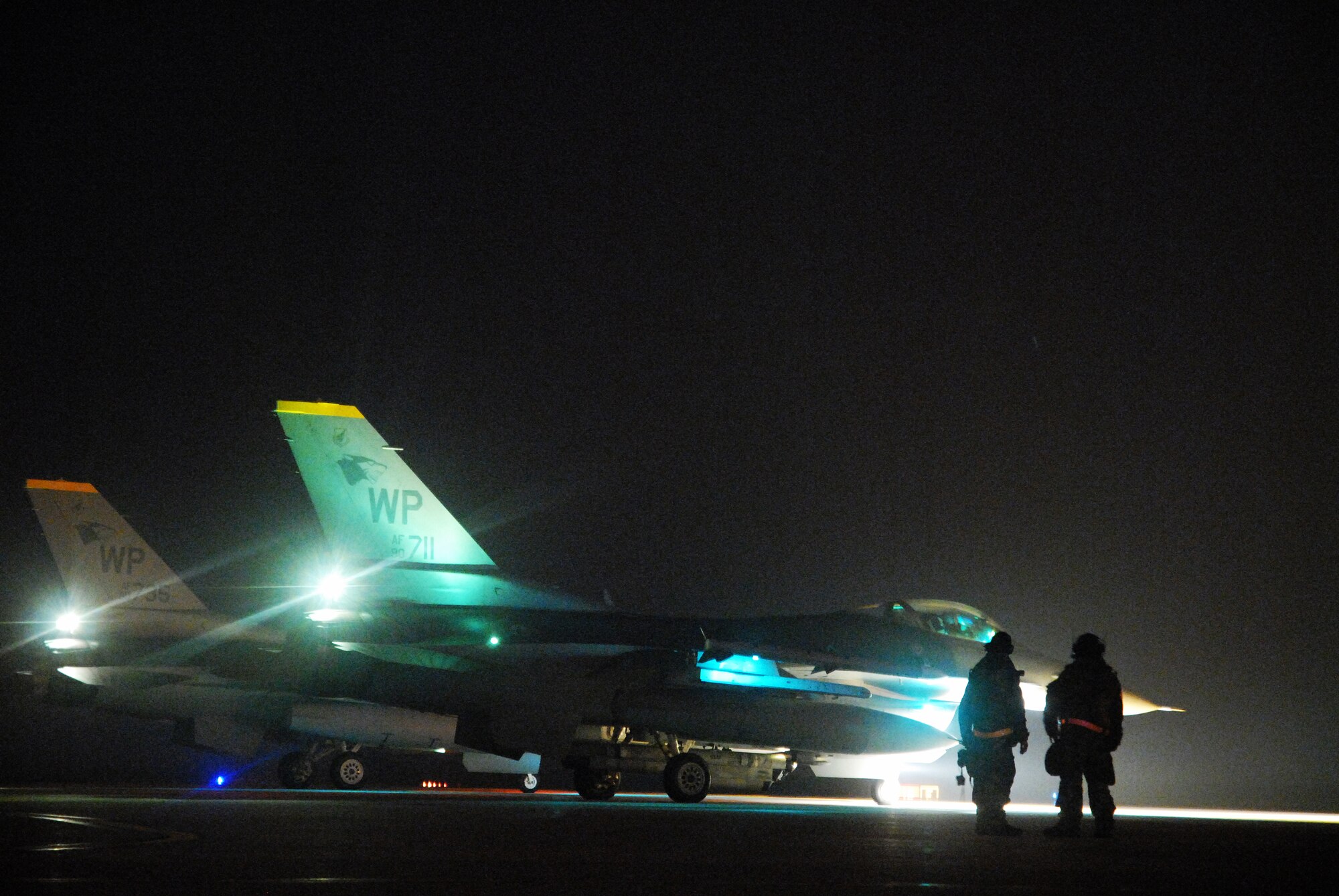 KUNSAN AIR BASE, Republic of Korea -- Two F-16 Fighting Falcons from the 80th Fighter Squadron prepare to launch during the BEVERLY BULLDOG 08-03 peninsula wide operational readiness exercise here July 2008. Kunsan is participating in the PENORE to evaluate its readiness and ability to perform its wartime mission.  (U.S. Air Force photo/Staff Sgt. Jason Colbert)