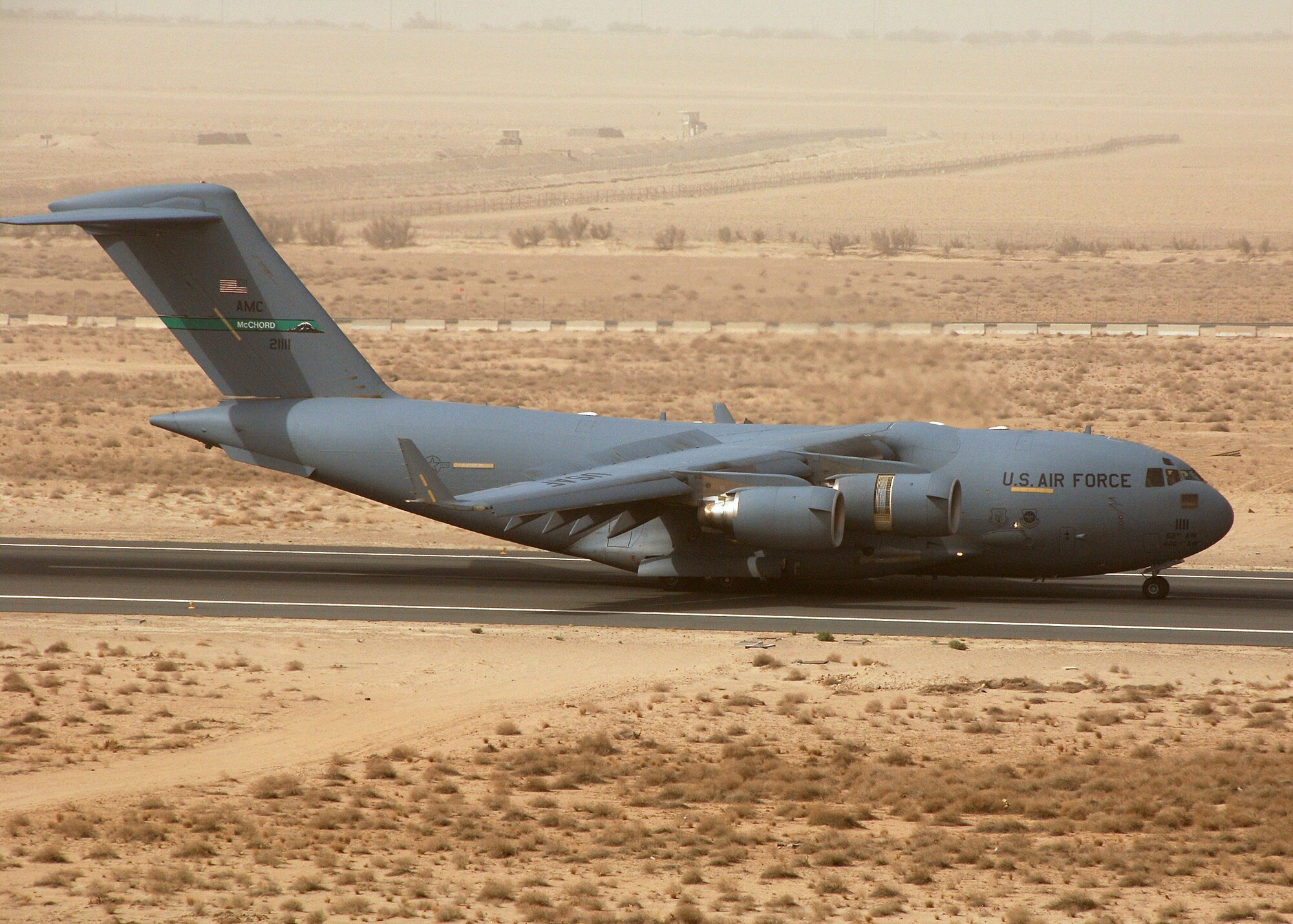 SOUTHWEST ASIA -- A C-17 taxies down the runway on July 19 at a base in Southwest Asia. The 386th Expeditionary Operation Support Squadron works with host nation air traffic controllers to safely ensure more than 2,000 takeoffs and landings per month are handled without incident. The C-17 is deployed from the 62nd Airlift Wing, McCord Air Force Base, Wash (U.S. Air Force photo/Tech. Sgt. Raheem Moore)