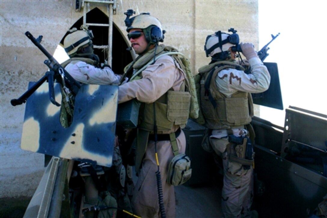 Sailors clear through a tower in the Euphrates River near Rawah, Iraq, July 11, 2008. Riverine units are actively engaged in waterborne operations in Anbar province to update census details, improve security and deter insurgent activity. The sailors are assigned to Riverine Squadron 3. 
