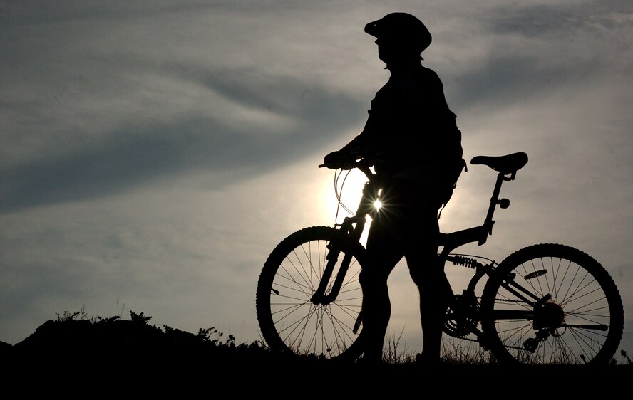 Tech. Sgt. Mark McLean, 718th Aircraft Maintenance Unit hydraulic technician, completes his long ride from Kadena Air Base to a beach near Camp Kinser July 22.   (U.S. Air Force photo/Tech. Sgt. Rey Ramon) 