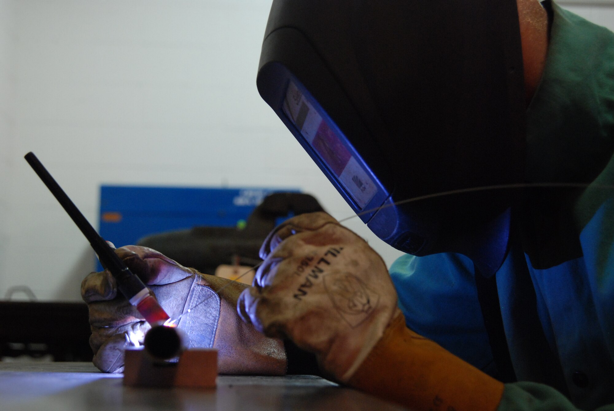 MCCONNELL AIR FORCE BASE, Kan. -- Staff Sgt. William Peters, 22nd Maintenance Squadron metals technician, welds a tube of weakened metal that will be used for an aircraft aft hatch barrier, here, July 24. (photo by Airman 1st Class Jessica Lockoski)