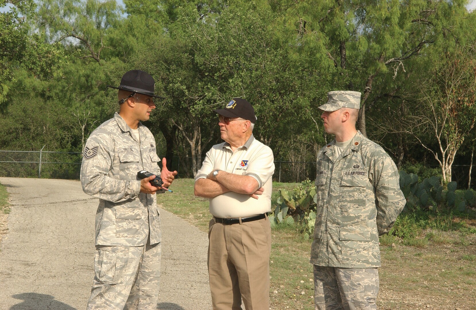 7/17/2008 - Retired Chief Master Sgt. Robert Gaylor, the fifth chief master sergeant of the Air Force, Tech. Sgt. Timothy Bruton, 737th Training Support Squadron, and Maj. Danny Davis, 324th Training Squadron, discus the changes taking place at basic military training July 17.  Chief Gaylor toured basic military training, seeing first-hand how the Air Force is developing warrior Airmen. (USAF photo by Alan Boedeker)