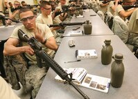7/10/2008 - Airman Geanny Hernandez Quiala practices breaking down and reassembling an M-16 during his fourth week of basic training July 10. (USAF photo by Robbin Cresswell)