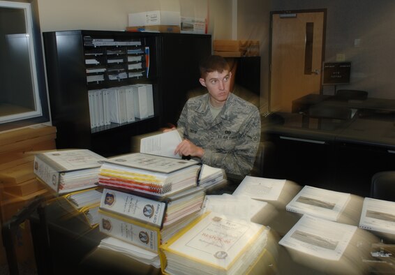 Airman 1st Class Elliott Snow listens to instructions while learning how to organize technical orders for KC-135 aircrews assigned to the 931st Air Refueling Squadron. The training was funded by an Air Force Reserve program designed to make traditional Reservists functional in their specialties at a faster rate. (U.S. Air Force photo/Tech. Sgt. Jason Schaap)