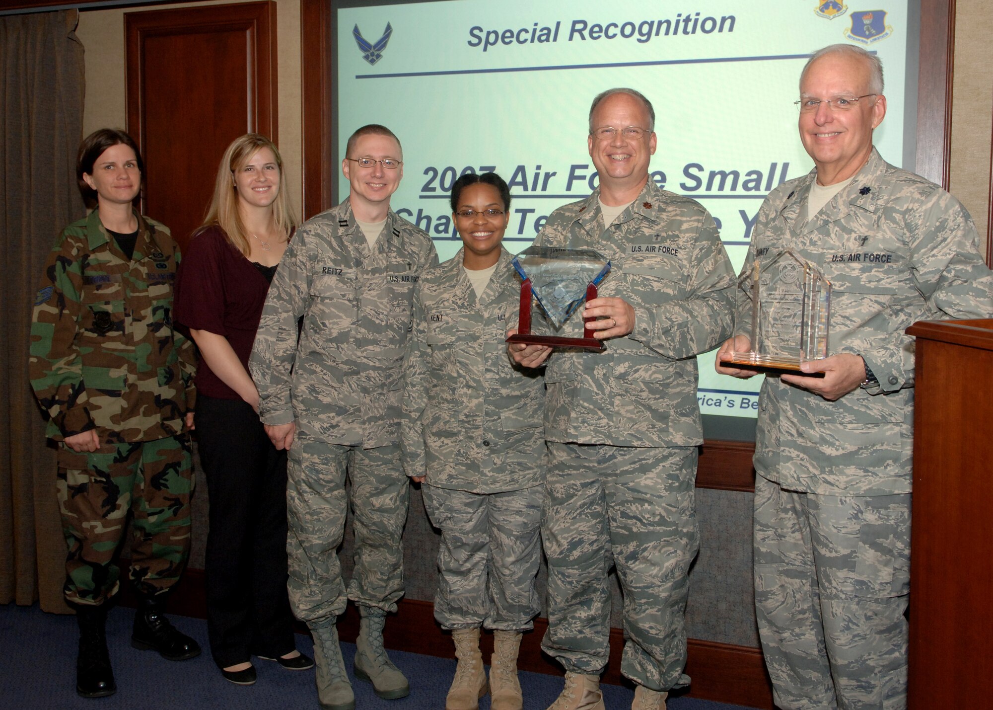Base Chapel staff was recognized recently as the 2007 Air Force small chapel team of the year. From left to right, Staff Sgt. Sara Eldridge, Ms. Janelle Holland, Chaplain (Capt.) Roland Reitz, Tech. Sgt. Shanda Kent, Chaplain (Maj.) Kevin Lockett and Wing Chaplain (Lt. Col.) John Kinney. (U.S. Air Force photo/Senior Airman Tiffany Colburn)
