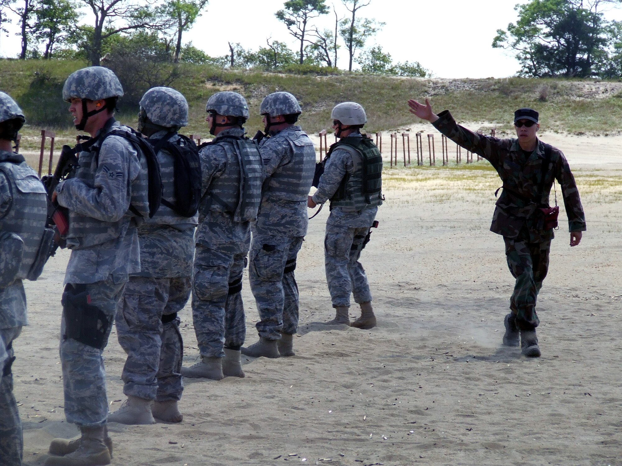 Staff Sgt. Brian Arrington, 421st Combat Training Squadron instructor, gives direction to students in the Air Force Phoenix Warrior Training Course during live tactical firing training on a Fort Dix, N.J., range June 20, 2008.  Phoenix Warrior is a security forces pre-deployment course offered by the U.S. Air Force Expeditionary Center and is taught by the 421st Combat Training Squadron.  (U.S. Air Force Photo/Tech. Sgt. Scott T. Sturkol)