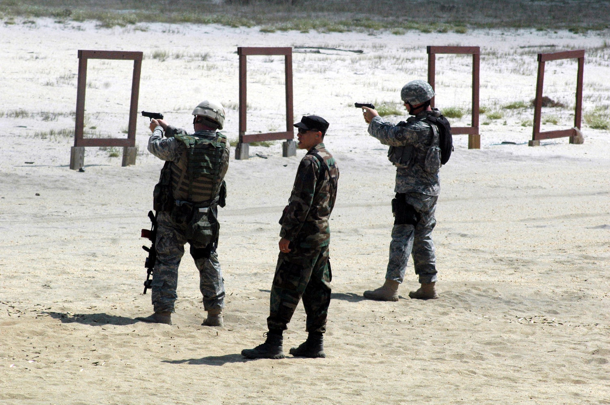 Staff Sgt. Brian Arrington, 421st Combat Training Squadron instructor, gives direction to students in the Air Force Phoenix Warrior Training Course during live tactical firing training on a Fort Dix, N.J., range June 20, 2008.  Phoenix Warrior is a security forces pre-deployment course offered by the U.S. Air Force Expeditionary Center and is taught by the 421st Combat Training Squadron.  (U.S. Air Force Photo/Tech. Sgt. Scott T. Sturkol)