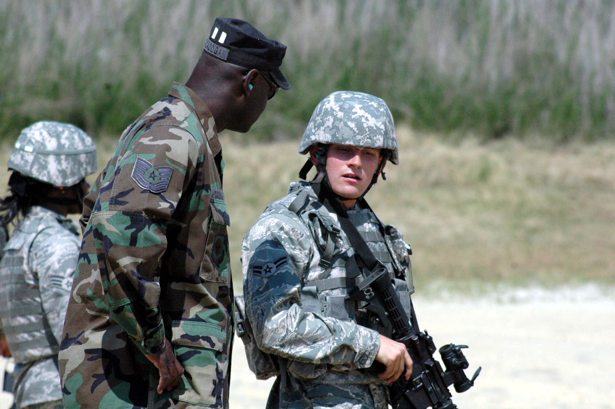 Tech. Sgt. Jeffrey Cadogan, 421st Combat Training Squadron instructor, gives direction to students in the Air Force Phoenix Warrior Training Course during live tactical firing training on a Fort Dix, N.J., range June 20, 2008.  Phoenix Warrior is a security forces pre-deployment course offered by the U.S. Air Force Expeditionary Center and is taught by the 421st Combat Training Squadron.  (U.S. Air Force Photo/Tech. Sgt. Scott T. Sturkol)