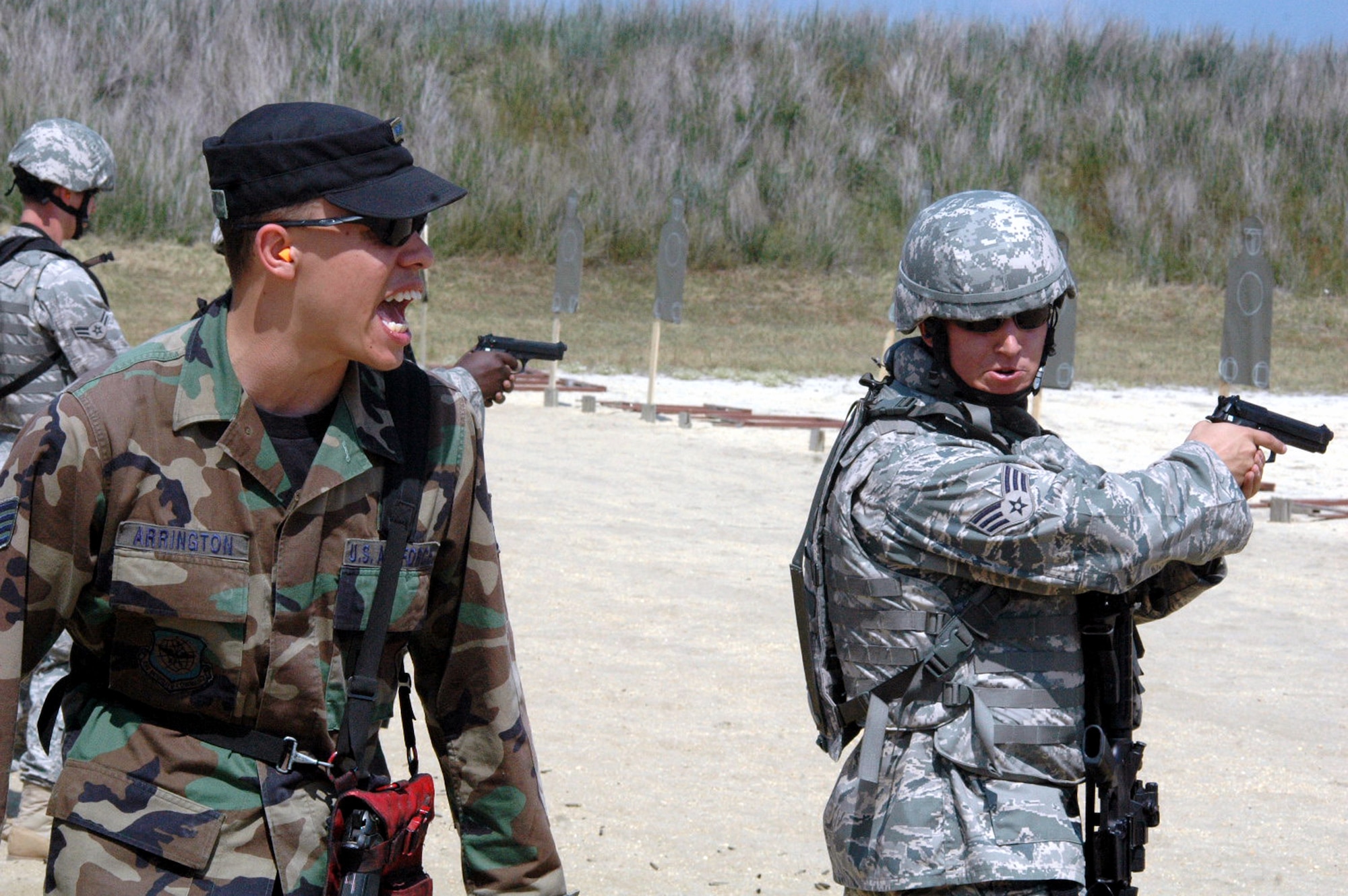 Staff Sgt. Brian Arrington, 421st Combat Training Squadron instructor, gives direction to students in the Air Force Phoenix Warrior Training Course during live tactical firing training on a Fort Dix, N.J., range June 20, 2008.  Phoenix Warrior is a security forces pre-deployment course offered by the U.S. Air Force Expeditionary Center and is taught by the 421st Combat Training Squadron.  (U.S. Air Force Photo/Tech. Sgt. Scott T. Sturkol)