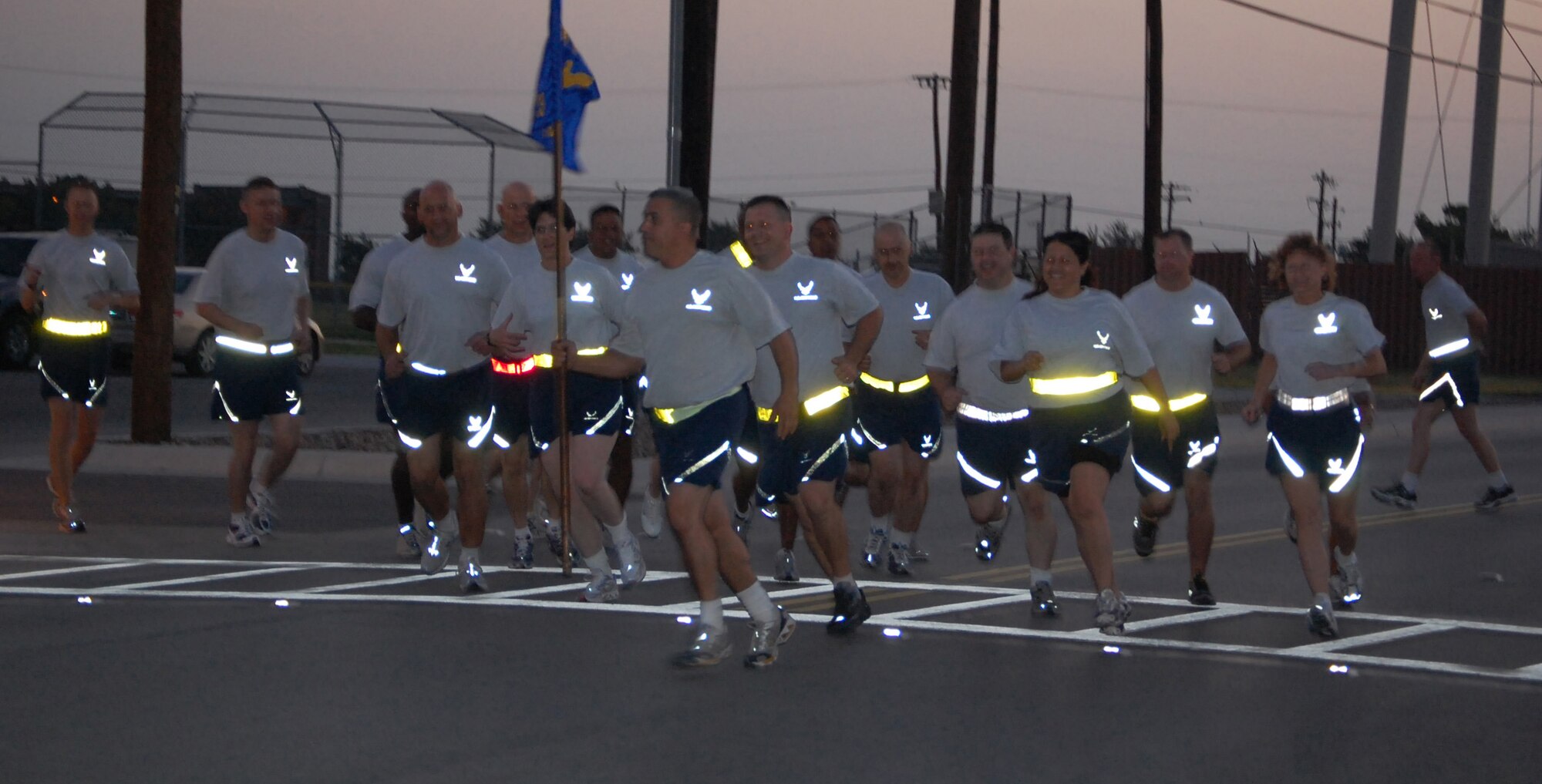 LAGUHLIN AIR FORCE BASE, Texas -- Just before dawn after warm-up exercises, members of Laughlin’s senior non-commissioned officers begin their 5-k run here July 18.  The Senior NCO Run, organized by Laughlin enlisted leadership to build teamwork and espirit de corps among members, takes place once every quarter.  (U.S. Air Force photo/Staff Sgt. Olufemi Owolabi) 