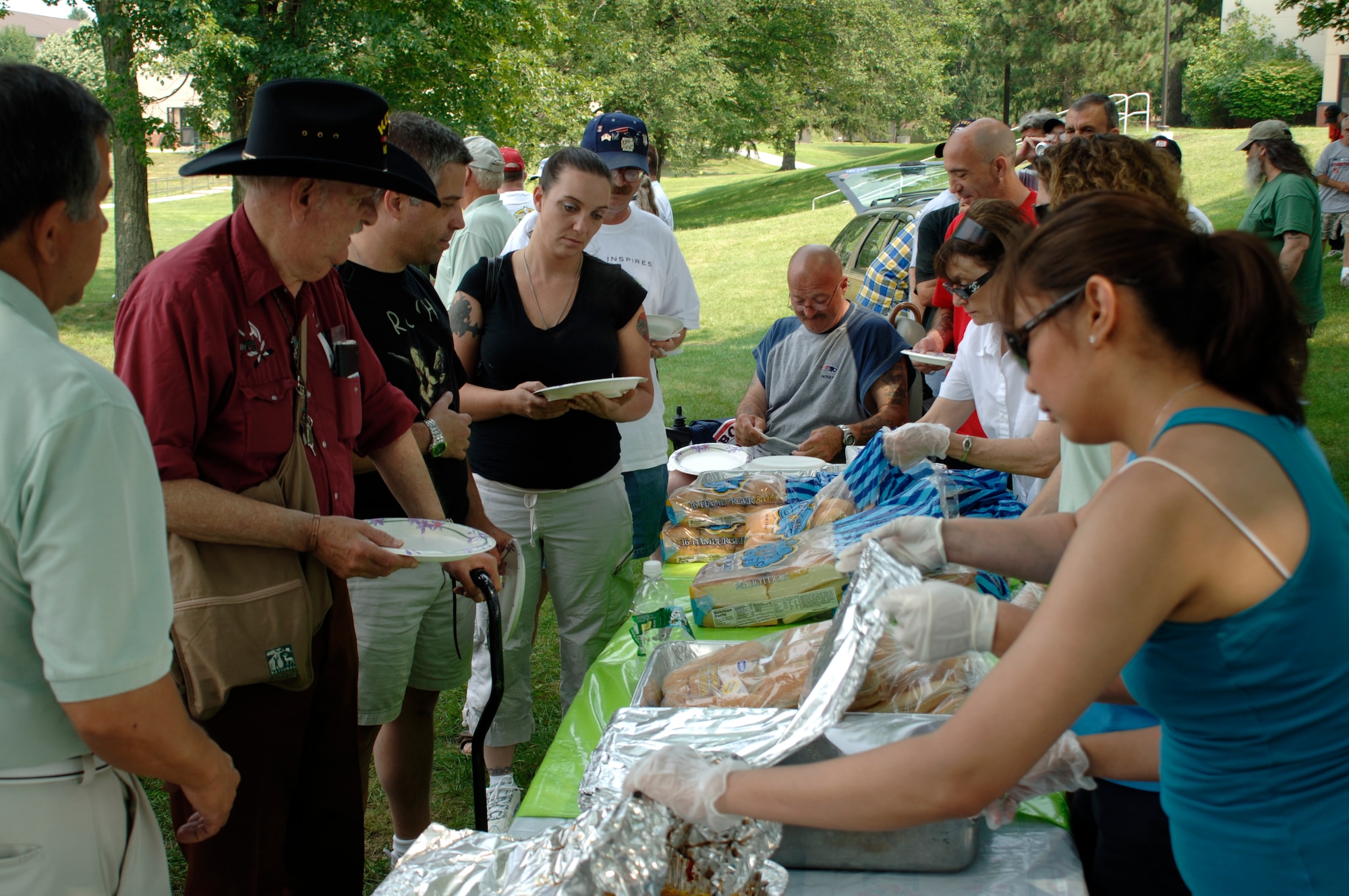 Volunteers from the Paul Revere Chapter of the Air Force Association and the Hanscom Air Force Sergeants Association serve veterans during a picnic at Hanscom July 19.  Hundreds of veterans from across the state turned out for the event, sponsored by the two associations, and enjoyed a full meal along with softball, horseshoes, volleyball and other games.  The 66th Air Base Wing supported the veterans event, providing equipment for the recreational activities, and helping out with the cooking and serving.  (U.S. Air Force photo by Rick Berry)