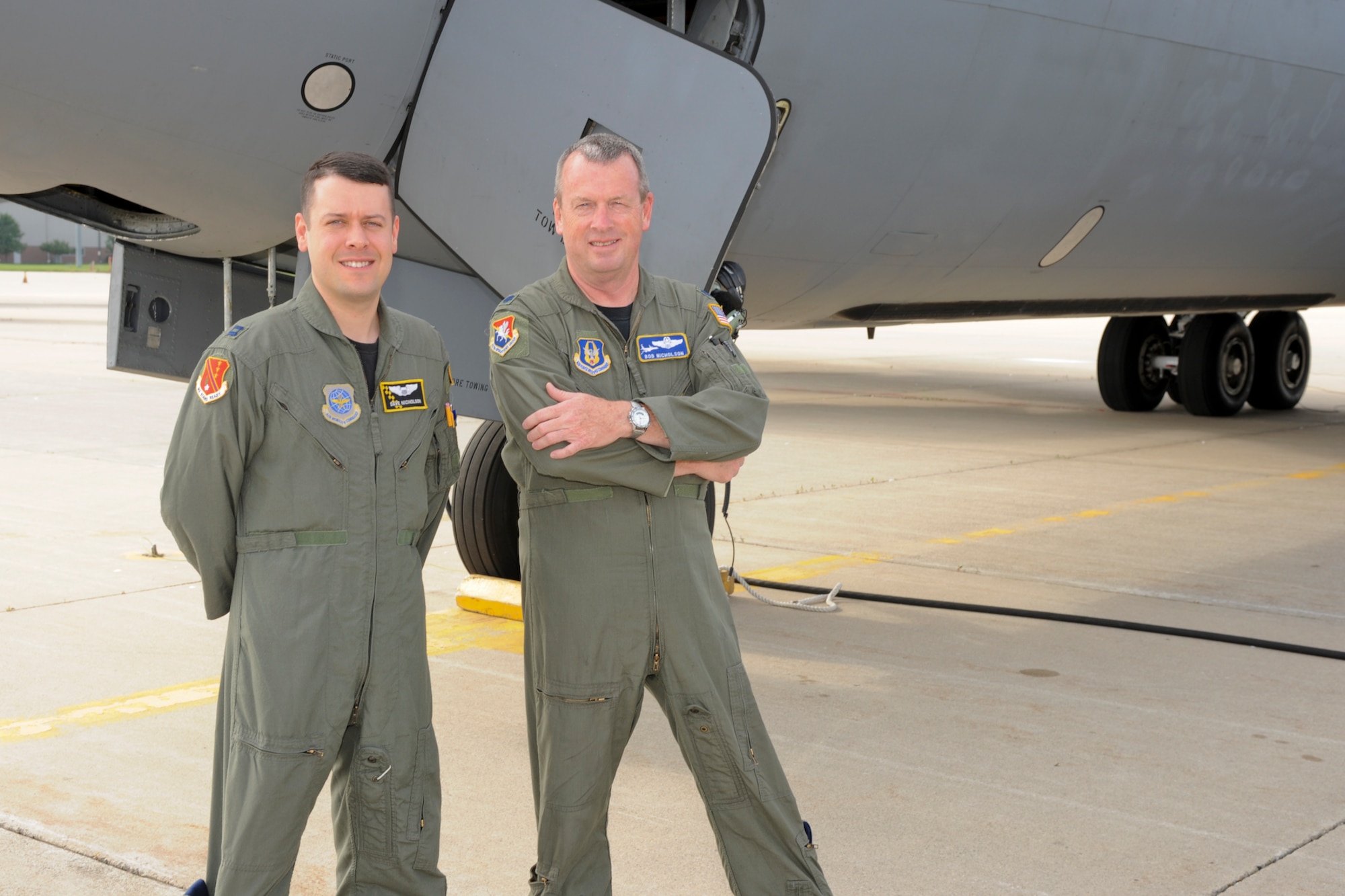 Capt. David Nicholson (left) 127th Air Refueling Group, Michigan Air National Guard, and his father, Lt. Col. Robert Nicholson, 63rd Refueling Squadron, Air Force Reserves, both stationed at Selfridge Air National Guard Base, prepare to fly together on Col. Nicholson's final flight as an Air Force pilot.  The unique mission required approvals by both the Air National Guard and the Air Force Reserves, as the pair are father and son. 