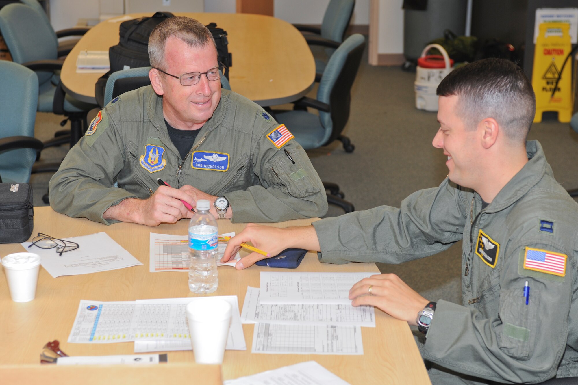 Capt. David Nicholson (right) 127th Air Refueling Group, Michigan Air National Guard, and his father, Lt. Col. Robert Nicholson, 63rd Refueling Squadron, Air Force Reserves, both stationed at Selfridge Air National Guard Base, prepare to fly together on Col. Nicholson's final flight as an Air Force pilot.  The unique mission required approvals by both the Air National Guard and the Air Force Reserves, as the pair are father and son.  