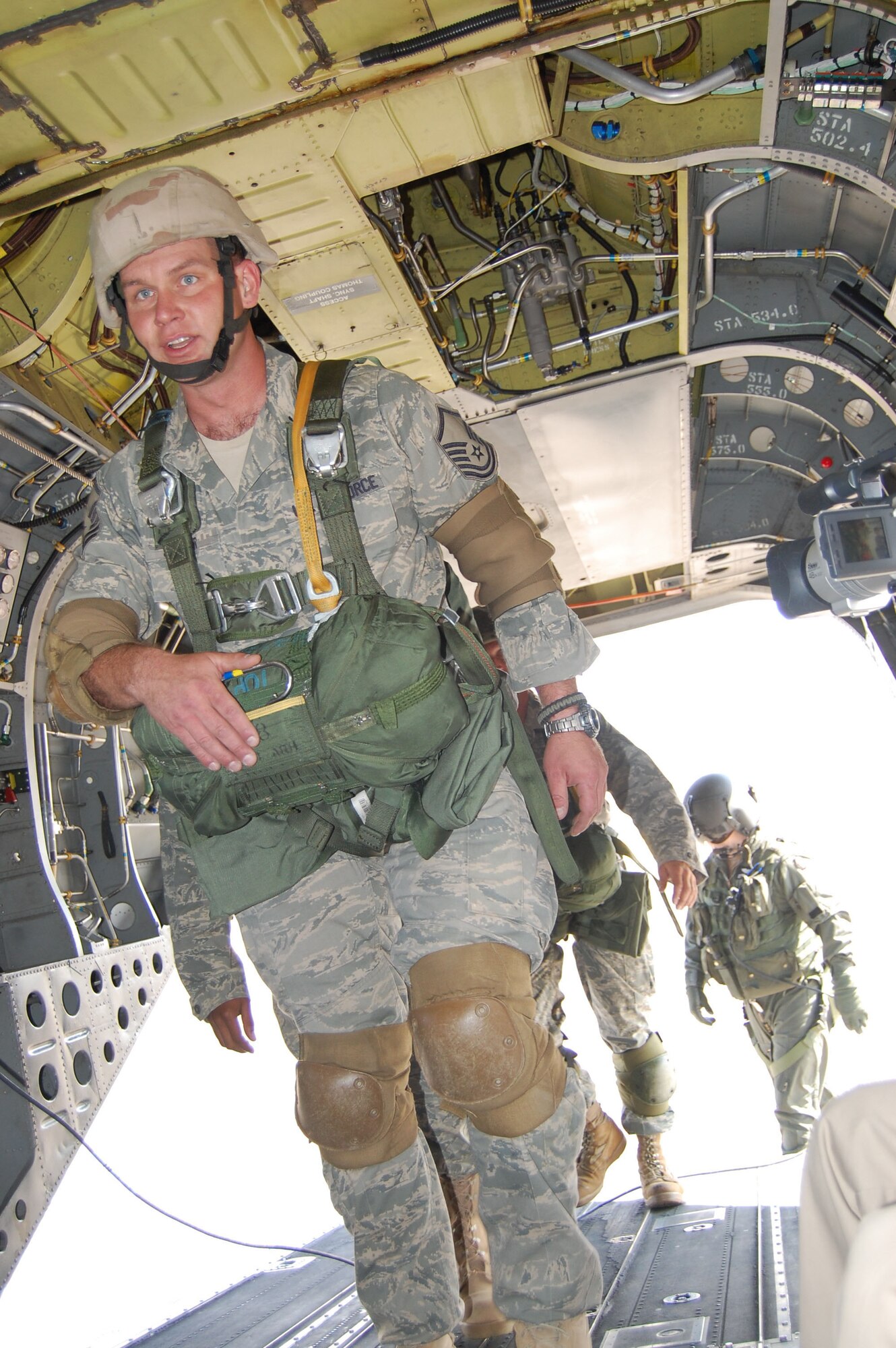 Master Sgt. Barry Snyder, 819th RED HORSE Squadron power production team member, boards a Montana Army National Guard Chinook helicopter for jump training July 23. Roughly 11 members of the 819th RHS participated in the jump which helps the airborne team meet quarterly training requirements.  (U.S. Air Force photo/Senior Airman Eydie Sakura)