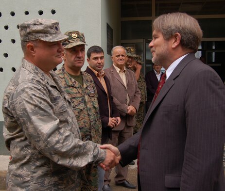 U.S. Ambassador to Bosnia-Herzegovina Charles English shakes hands with the Lt. Col. John McVicker, commander of the Maryland Air National Guard’s 175th Civil Engineer Squadron during a visit to the Vuk Karadzic primary school in Vlasenica, Bosnia-Herzegovina July 24, 2008. The school was in the process of being renovated by members of the Maryland National Guard as part of a humanitarian civic action project under the auspices of the National Guard’s State Partnership Program. (U.S. Air Force photo by Tech. Sgt. David D. Speicher)
