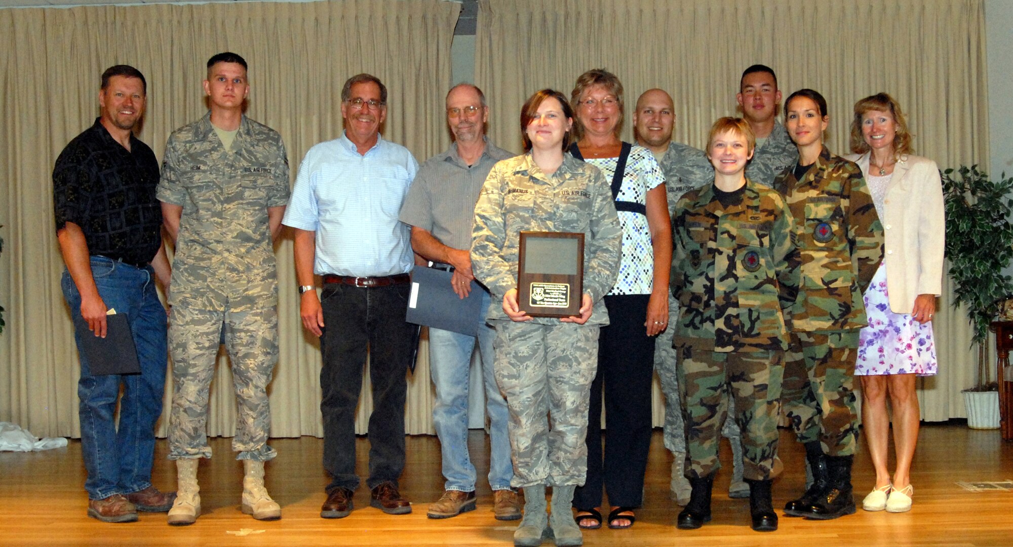 Malmstrom conducted the third quarter Quarterly Awards breakfast at the Grizzly Bend Club July 22. Winners pictured from left to right are: Gary Martin, Civilian Supervisor Category I; Airman 1st Class Adam Heim, Airman of the Quarter; James Hodges, Civilian Supervisor Category II; James Leighland, Civilian Employee Category II; Staff Sgt. Christena McManus, Renea Hutchins, Tech. Sgt. Jason Knecht, Staff Sgt. Mary Queen and 1st Lt. Tara Lovell, members of the TRICARE and Patient Administration Flight Team Award winners; Staff Sgt. Neil Young, Honor Guard member of the Quarter; and Trish Indreland, Civilian Employee, Category I winner. Not pictured are Staff Sgt. Jonathan Taylor, NCO of the Quarter; Master Sgt. Steven Small, Senior NCO of the Quarter; and Capt. Birju Patel, Company Grade Officer of the Quarter. (U.S. Air Force photo/Christy Mason)