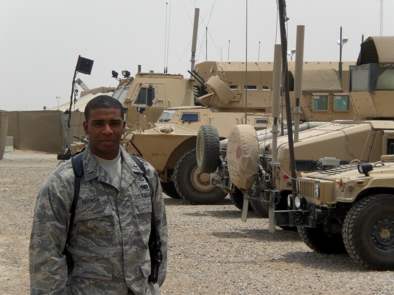 1st Lt. Navondi Hooker, 43rd Logistics Readiness Squadron, stands in front of some of his vehicles that are part of the fleet he commands at Camp Bucca, Iraq. (U.S. Air Force Photo)