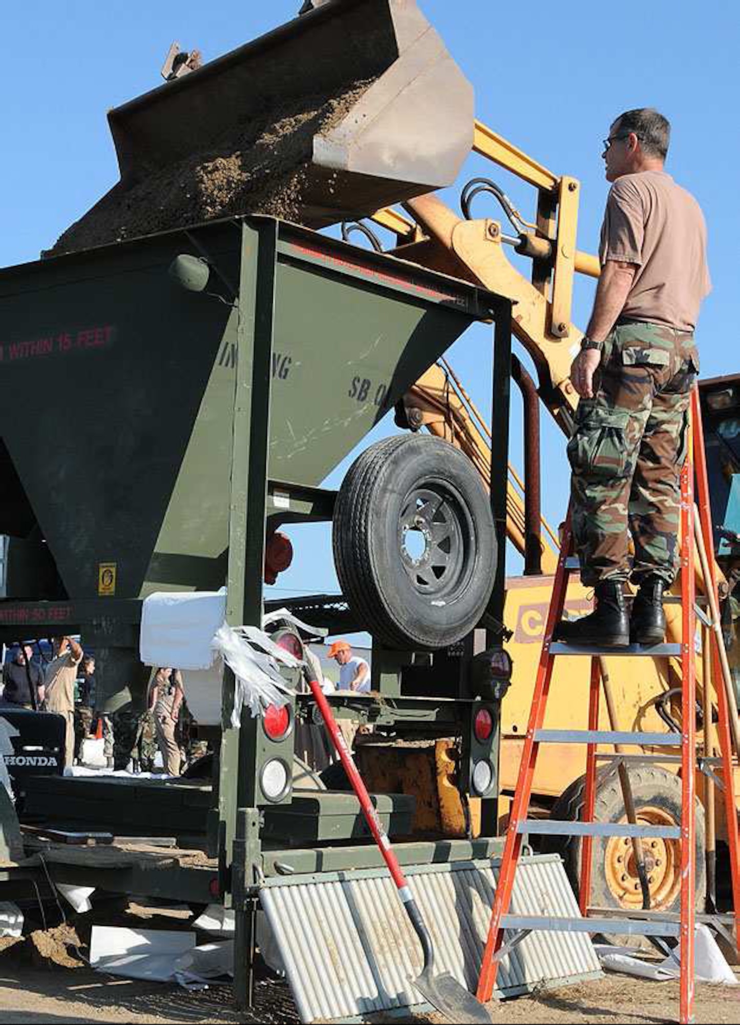 Indiana Air National Guard members continuously fill sandbags in relief following the flood waters that hit Vigo County June 7. The guardsmen are assigned to the 181st Intelligence Wing from Terre Haute, Ind. (photo by TSgt Michael W. Kellams) 