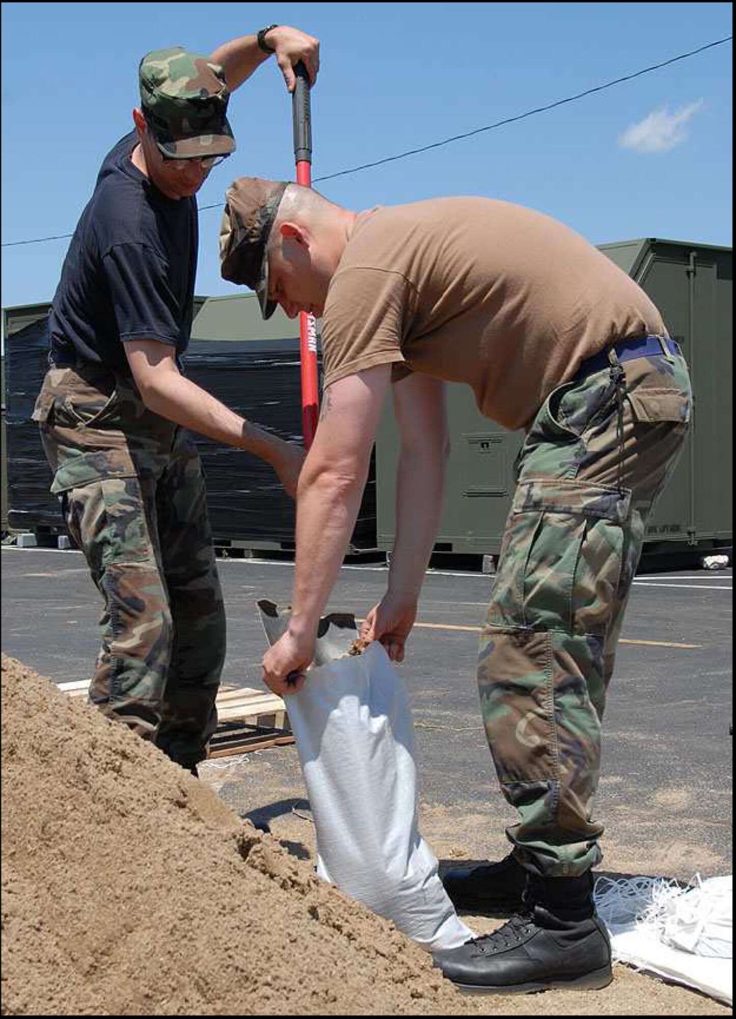 Indiana Air National Guard members continuously fill sandbags in relief following the flood waters that hit Vigo County June 7. The guardsmen are assigned to the 181st Intelligence Wing from Terre Haute, Ind. (U.S. Army photo/Staff Sgt. Chris Jennings) 