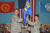 Col. Robert Bender, commander of the 704th Mission Support Group at Arnold Engineering Development Center (AEDC), hands the command flag to the new 704th Civil Engineering Squadron Commander Lt. Col. Saroya Follender. As squadron commander, she will be responsible for 24 government personnel and oversight of more than 400 contractors providing emergency and environmental services; housing and real property management and planning, programming, design and execution maintaining $7.8 billion infrastructure. 

Prior to coming to AEDC, Colonel Follender was the commander, operations flight 314th Civil Engineer Squadron at Little Rock AFB, Ark. She led 195 military and civilian technicians and engineers in the maintenance, repair and minor construction. 

She earned her Bachelor of Science degree in electrical engineering from Tufts University in Medford, Mass. She entered the Air Force in January 1991 through ROTC after graduation from Tufts. In 1995, she earned a Master of Science degree in engineering and environmental management for the Air Force Institute of Technology. She graduated from the College of Naval Command and Staff with a Master of Arts degree in national security and strategic studies. 
