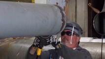 Lannie Jenkins, an Aerospace Testing Alliance pipefitter at the Propulsion Wind Tunnel, prepares a section of piping for a weld-in expansion joint as part of a major Engine Test Facility-focused maintenance and repair outage on base. (Photo by Warner Holt)