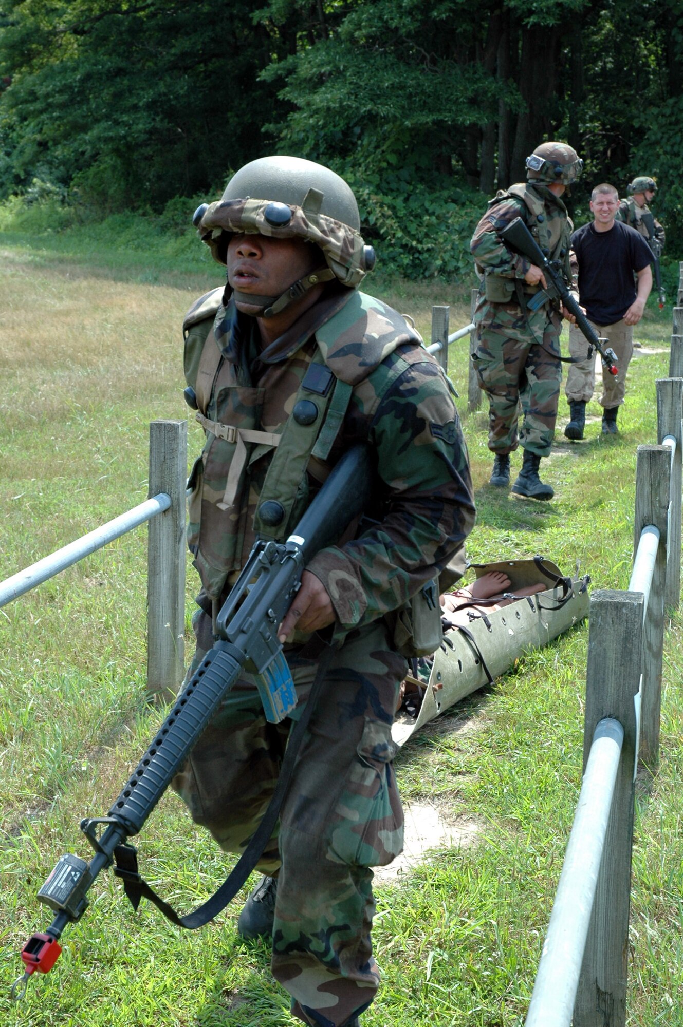 Students in the Advanced Contingency Skills Training Course 08-5 practice combat first aid training on a Fort Dix, N.J., range July 17, 2008.  ACST, taught by the U.S. Air Force Expeditionary Center's 421st Combat Training Squadron, prepares Airmen for upcoming deployments.  (U.S. Air Force Photo/Staff Sgt. Paul R. Evans)