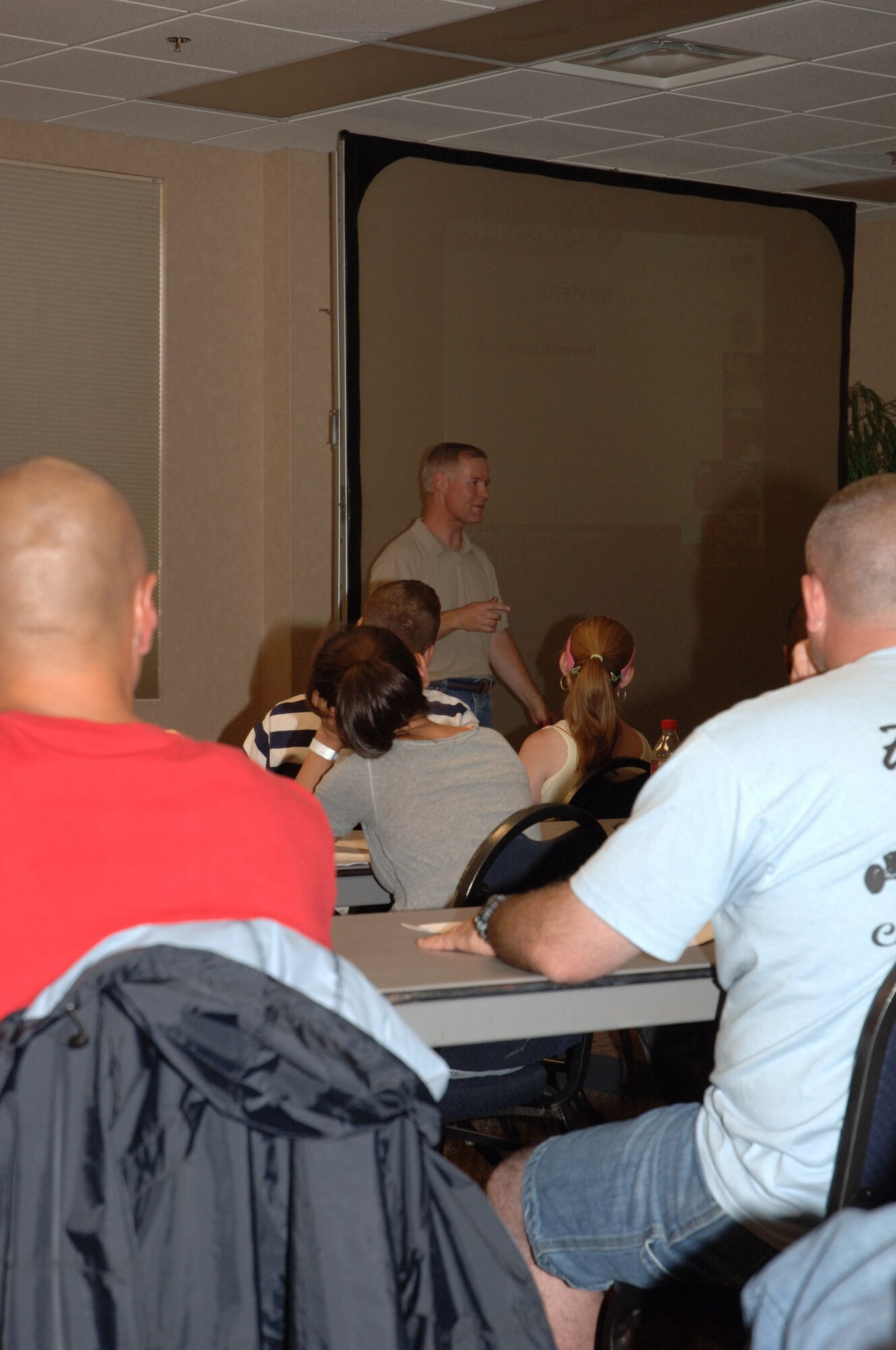 Capt. Daniel Morey, 377th Air Base Wing Chaplain, gives a seminar to military couples about the importance of communication during deployments on July 19th during the C.O.P.E. Retreat at Glorieta Convention Center and Resort in Glorieta, N.M. (U.S. Photo by Staff Sgt. Giana Jaworski)