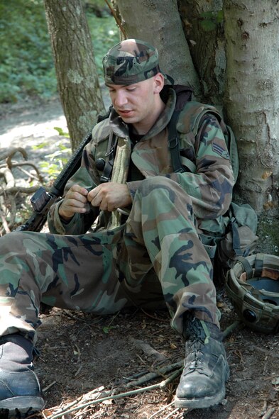 A student in the Advanced Contingency Skills Training Course 08-5 takes a break after completing the combat first aid obstacle course during training in ACST July 16, 2008, on a Fort Dix, N.J., range.  ACST, taught by the U.S. Air Force Expeditionary Center's 421st Combat Training Squadron, prepares Airmen for upcoming deployments.  (U.S. Air Force Photo/Staff Sgt. Paul R. Evans)